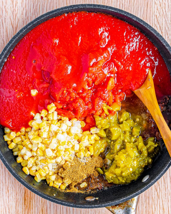 add in the diced tomatoes, frozen corn, tomato sauce, green chilis, salt and pepper, and cumin