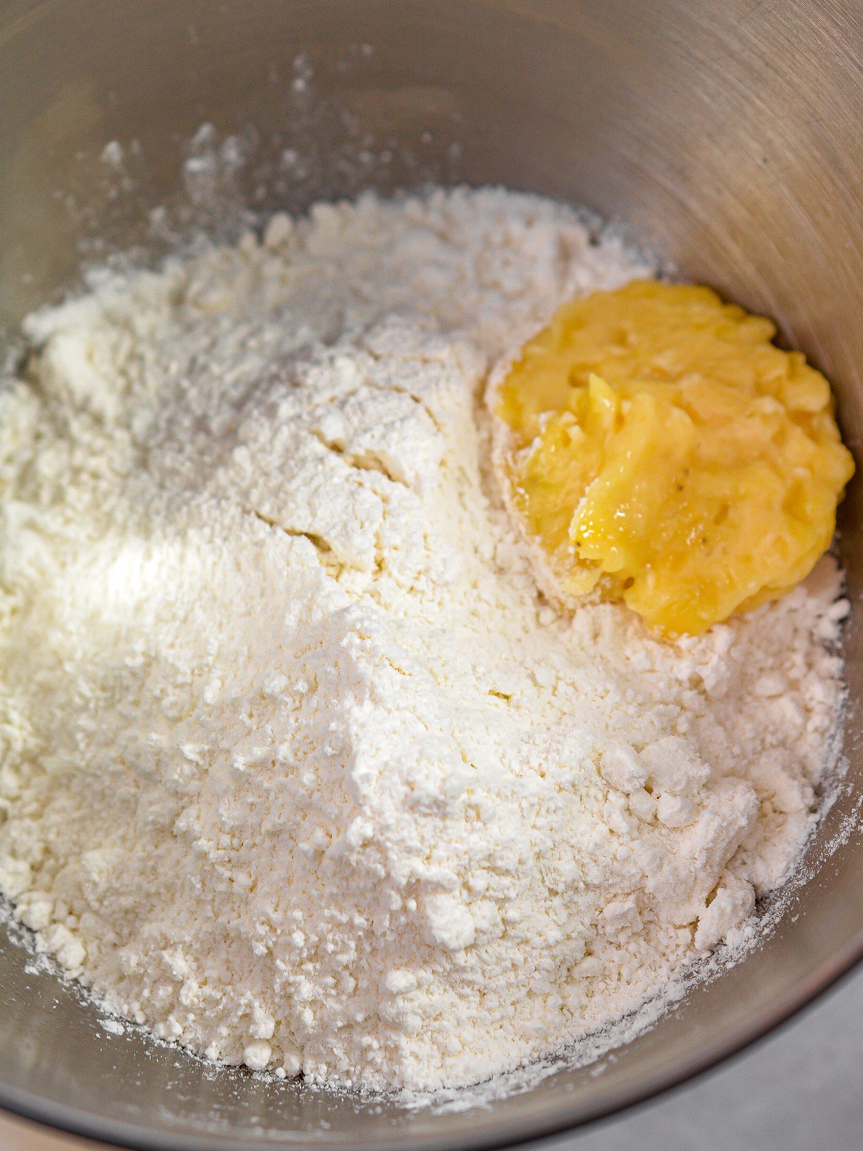  In a mixing bowl, blend the white cake mix according to package instructions. 