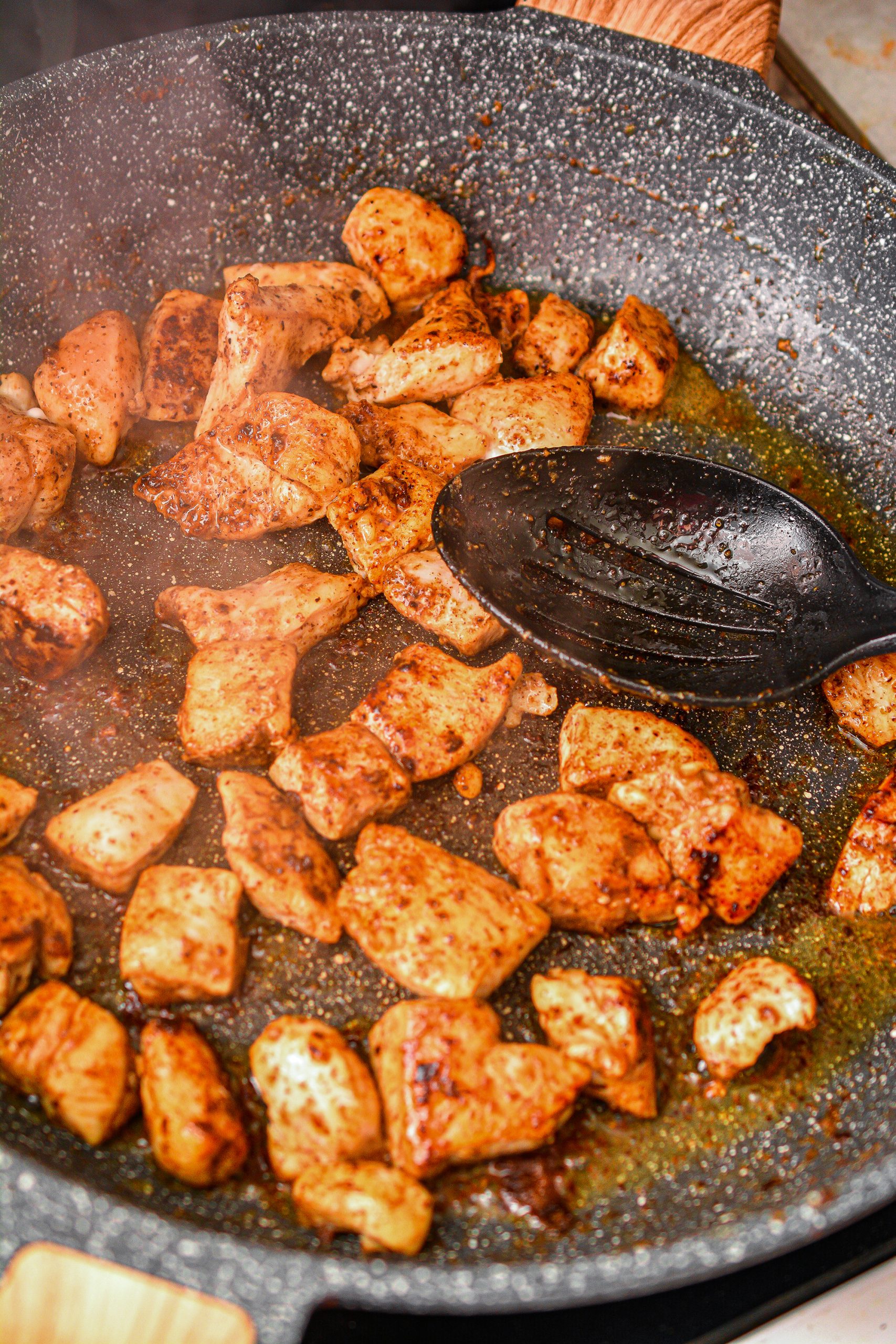 Place 2 Tbsp butter into the skillet and saute the chicken pieces with 1 Tbsp of cajun seasoning