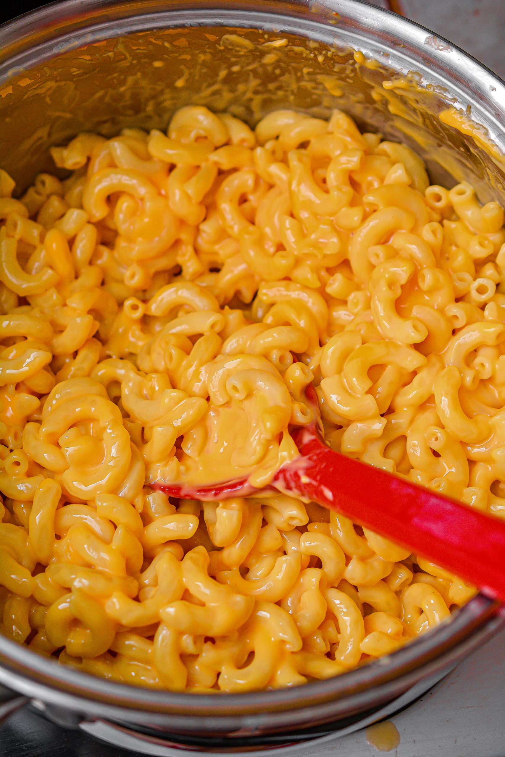 Add the Velveeta cheese to the pot with the macaroni, and stir until melted and combined. 