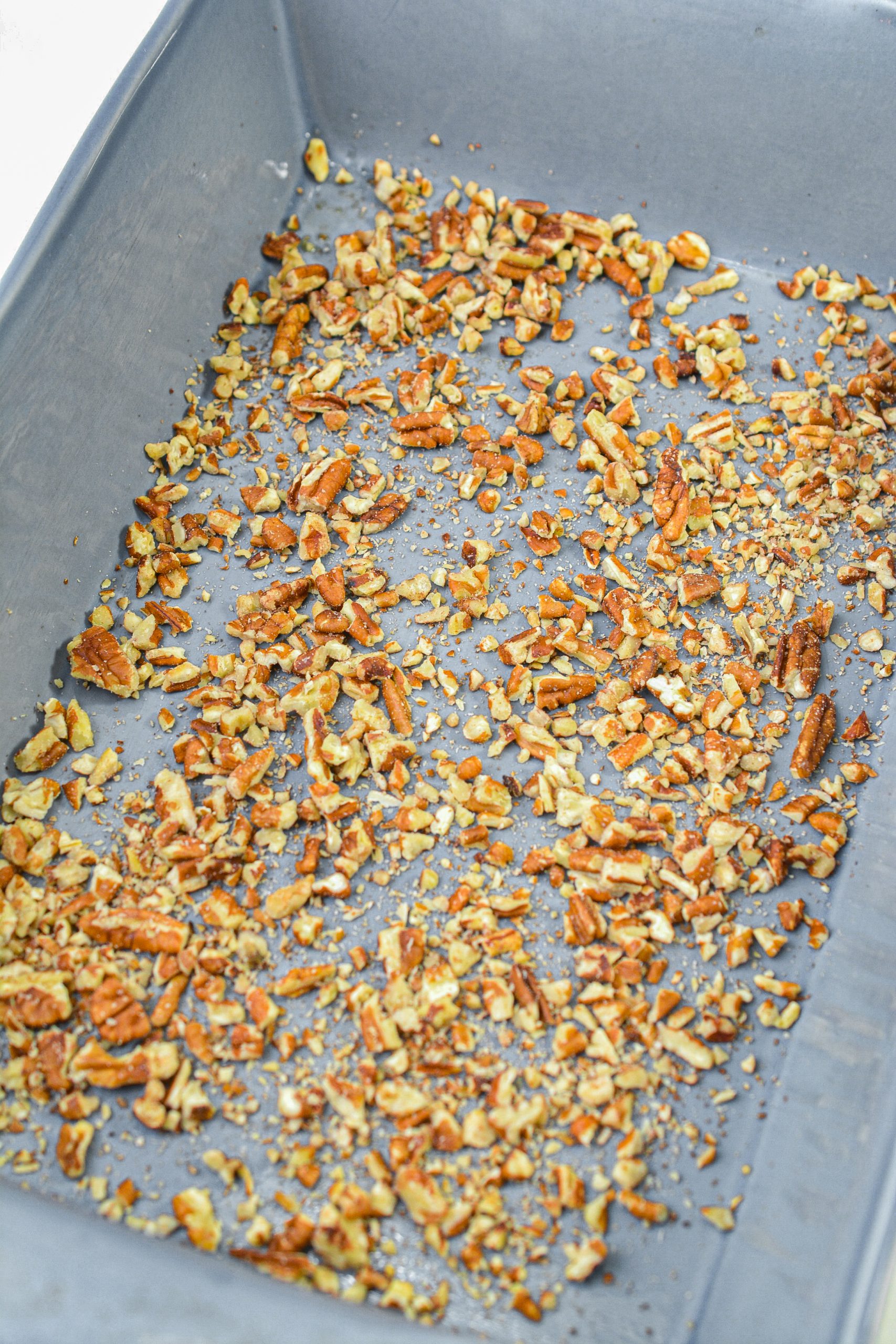 Sprinkle ½ cup of chopped pecans and 1 ½ cups of shredded coconut in the bottom of a well-greased casserole dish.
