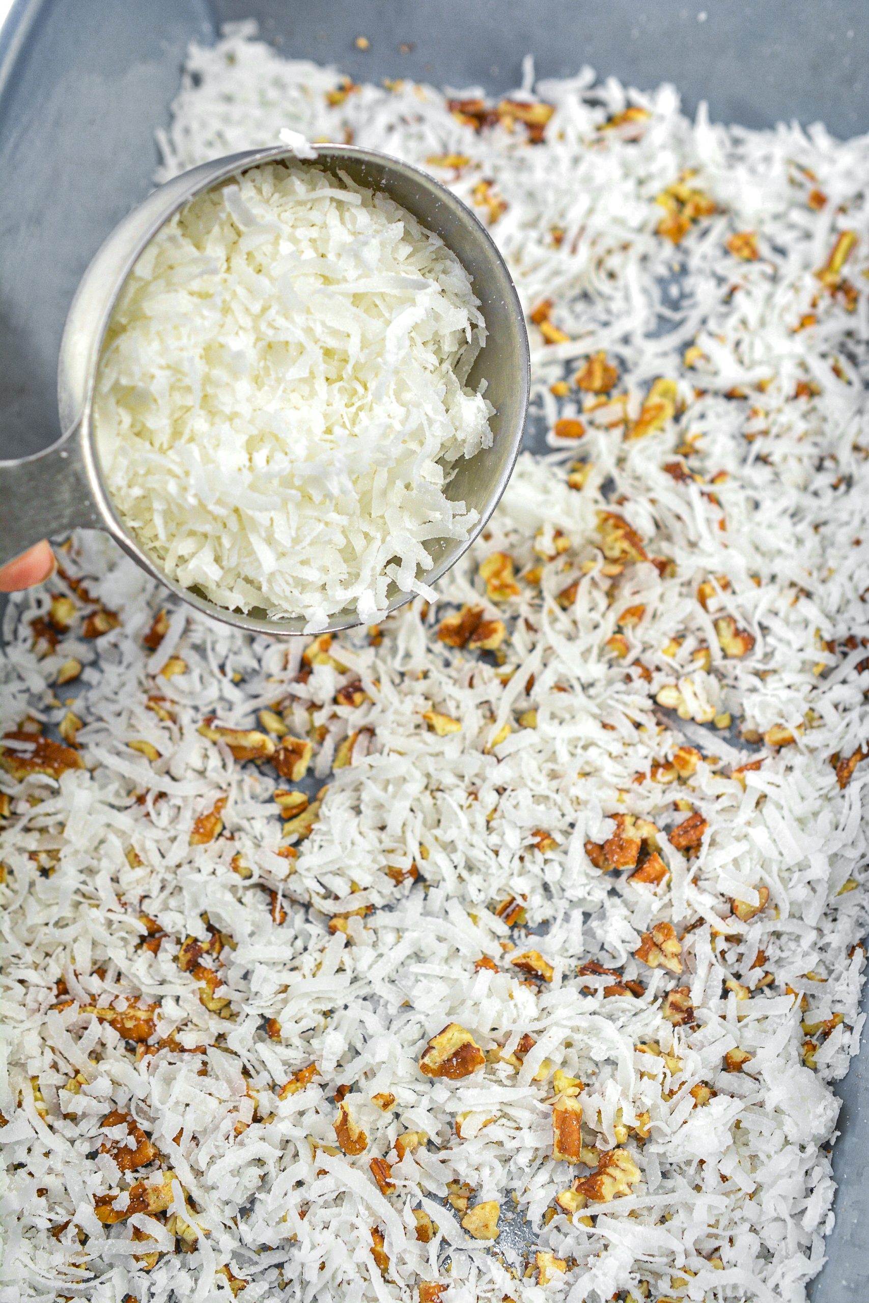 1 ½ cups of shredded coconut in the bottom of a well-greased casserole dish.