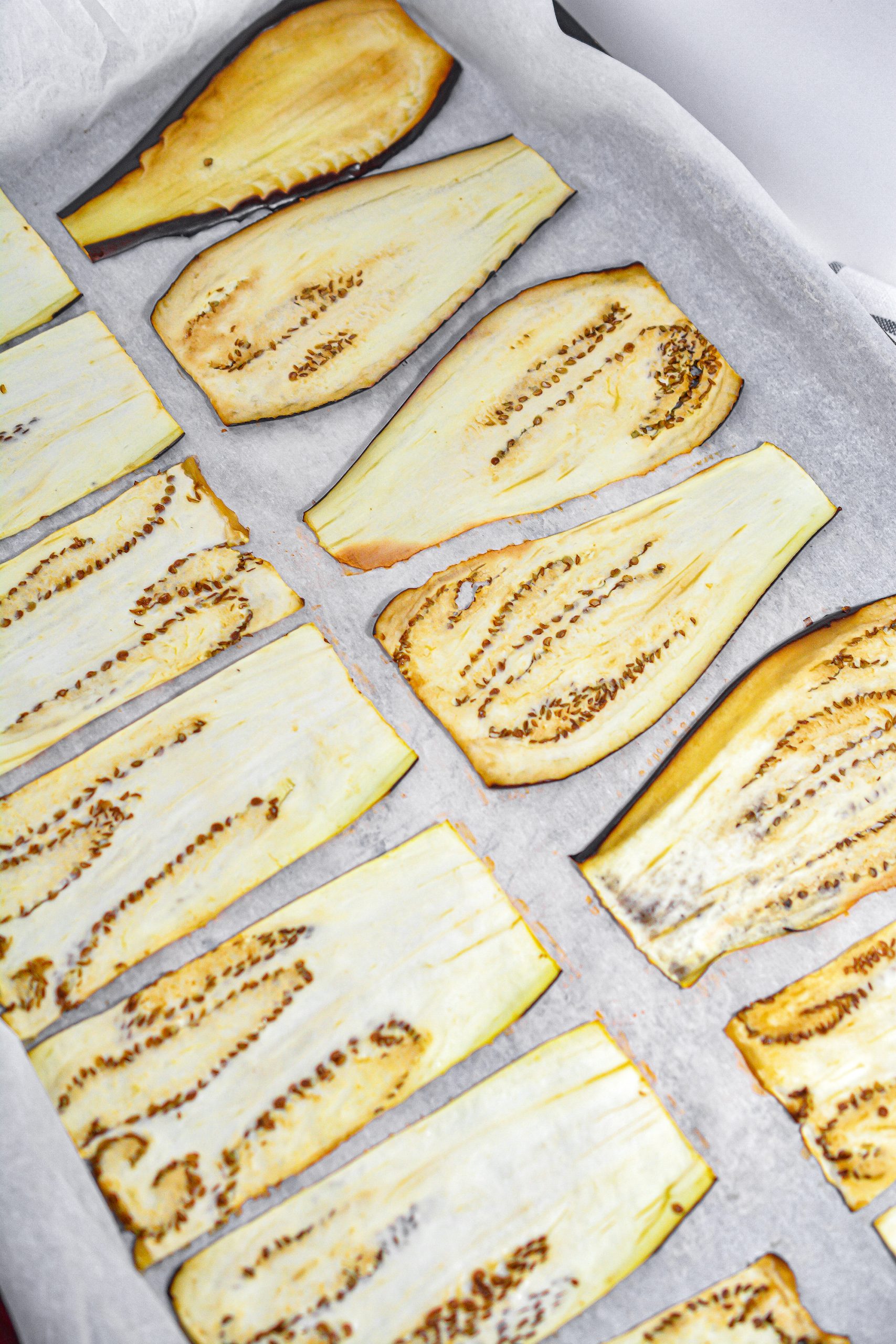  Place the eggplant on a parchment-lined baking sheet and bake for 10 minutes. 