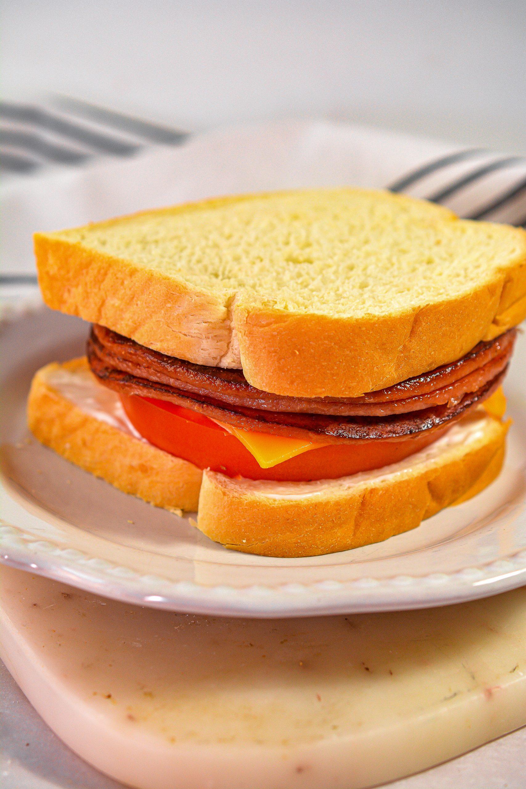 Top each sandwich with the remaining pieces of bread and serve.