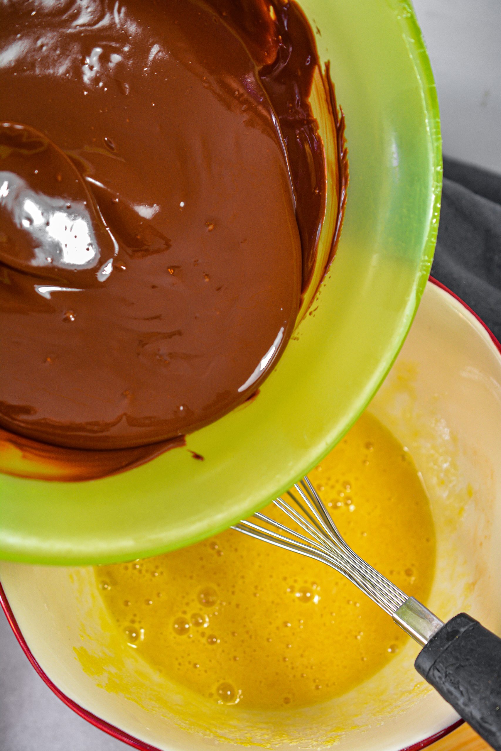 Add the chocolate mixture to the egg mixture, and whisk to combine. 