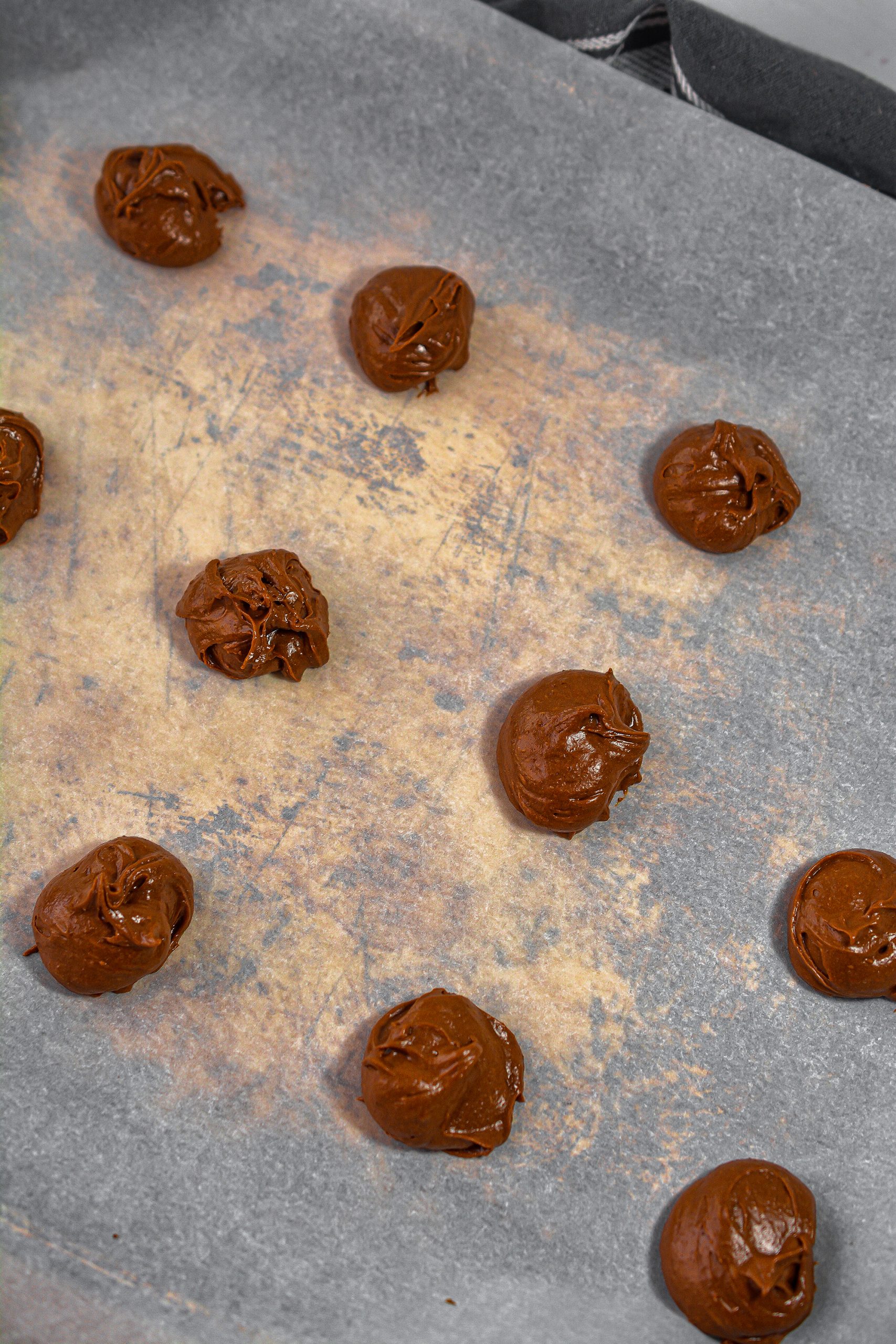Drop the batter by the teaspoonful onto a parchment-lined baking sheet. 