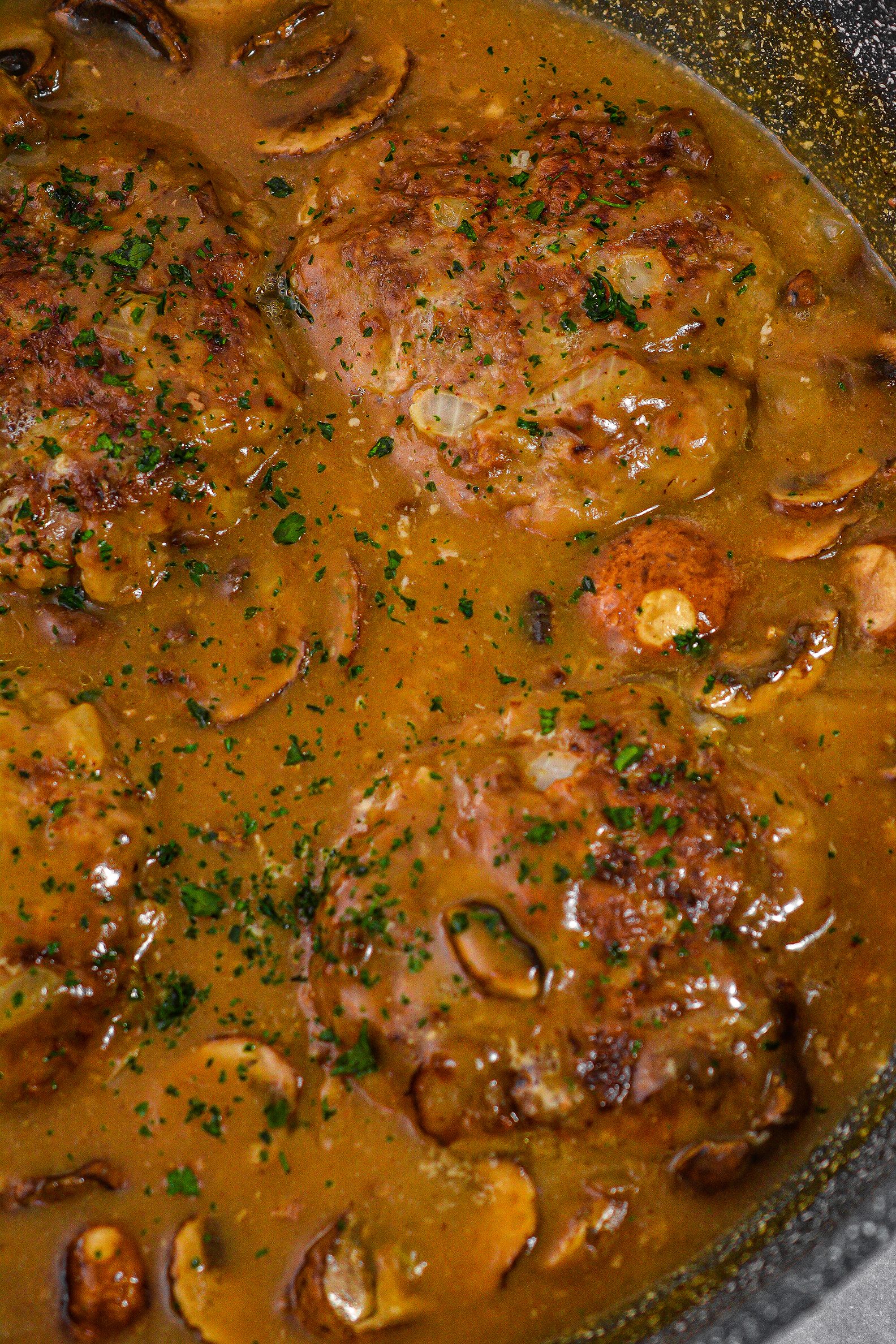 Stir in the mushrooms, and return the patties to the skillet.