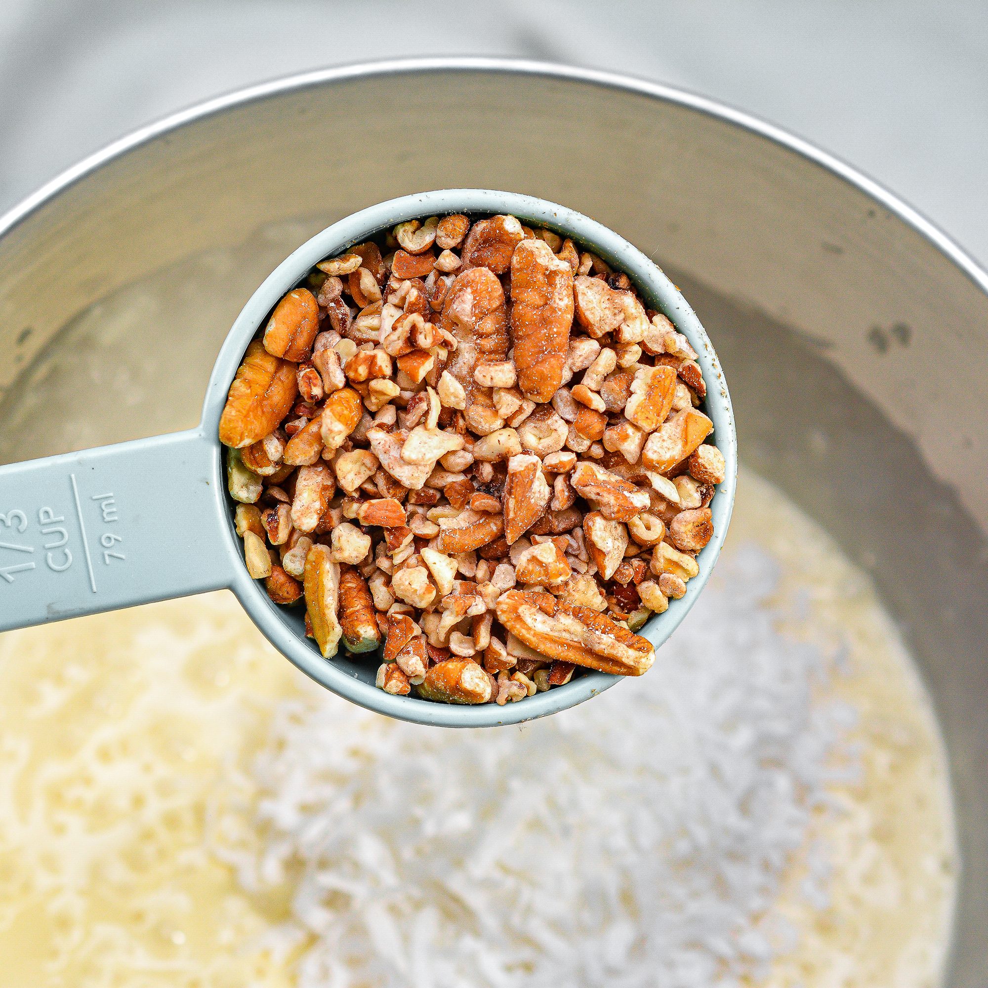  Fold the pecans and shredded coconut into the batter.