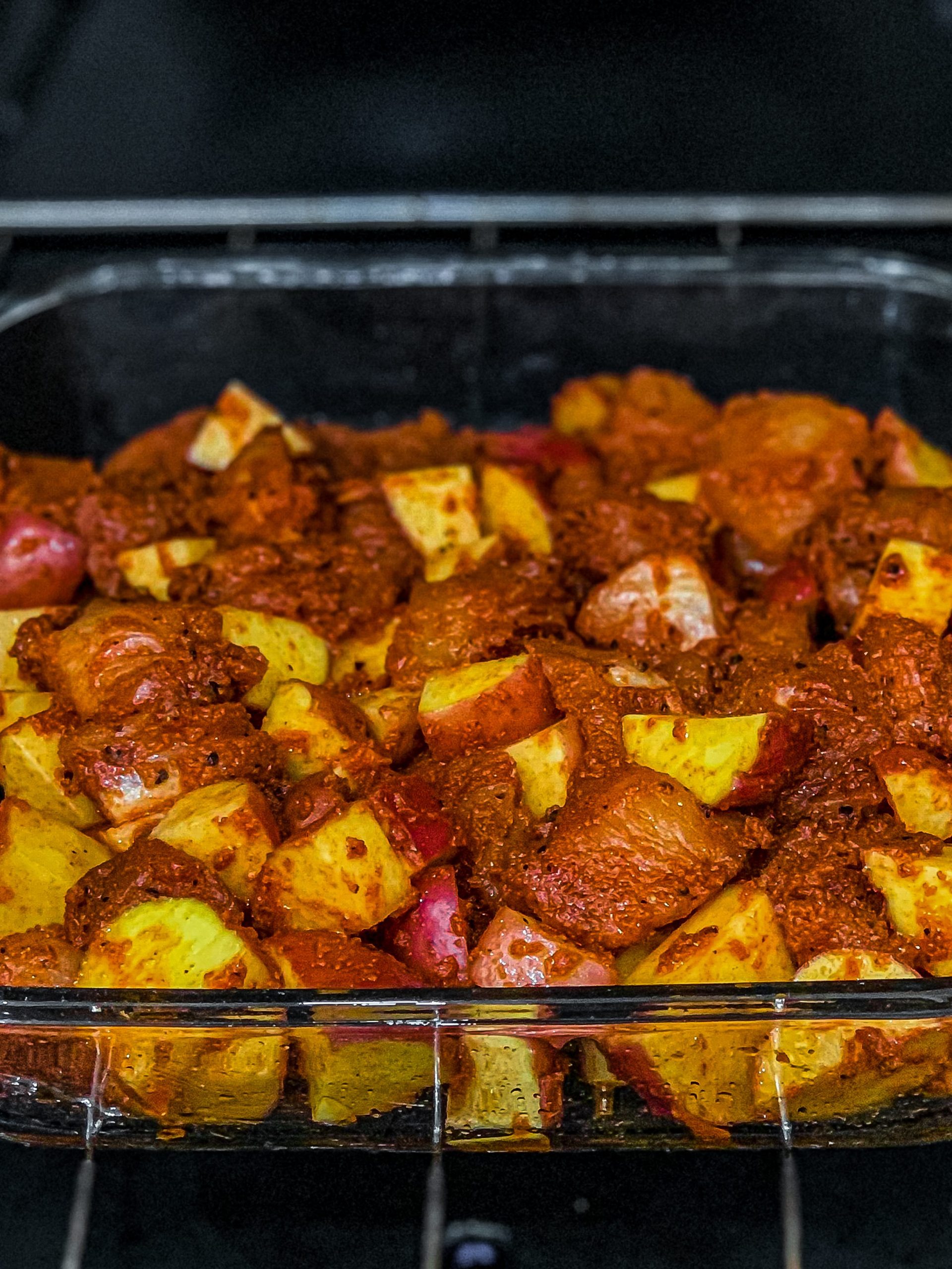 Pour the chicken and potatoes into the prepared baking dish and bake for 45 minutes, stirring every 15 minutes until cooked through, crispy, and browned on the outside.