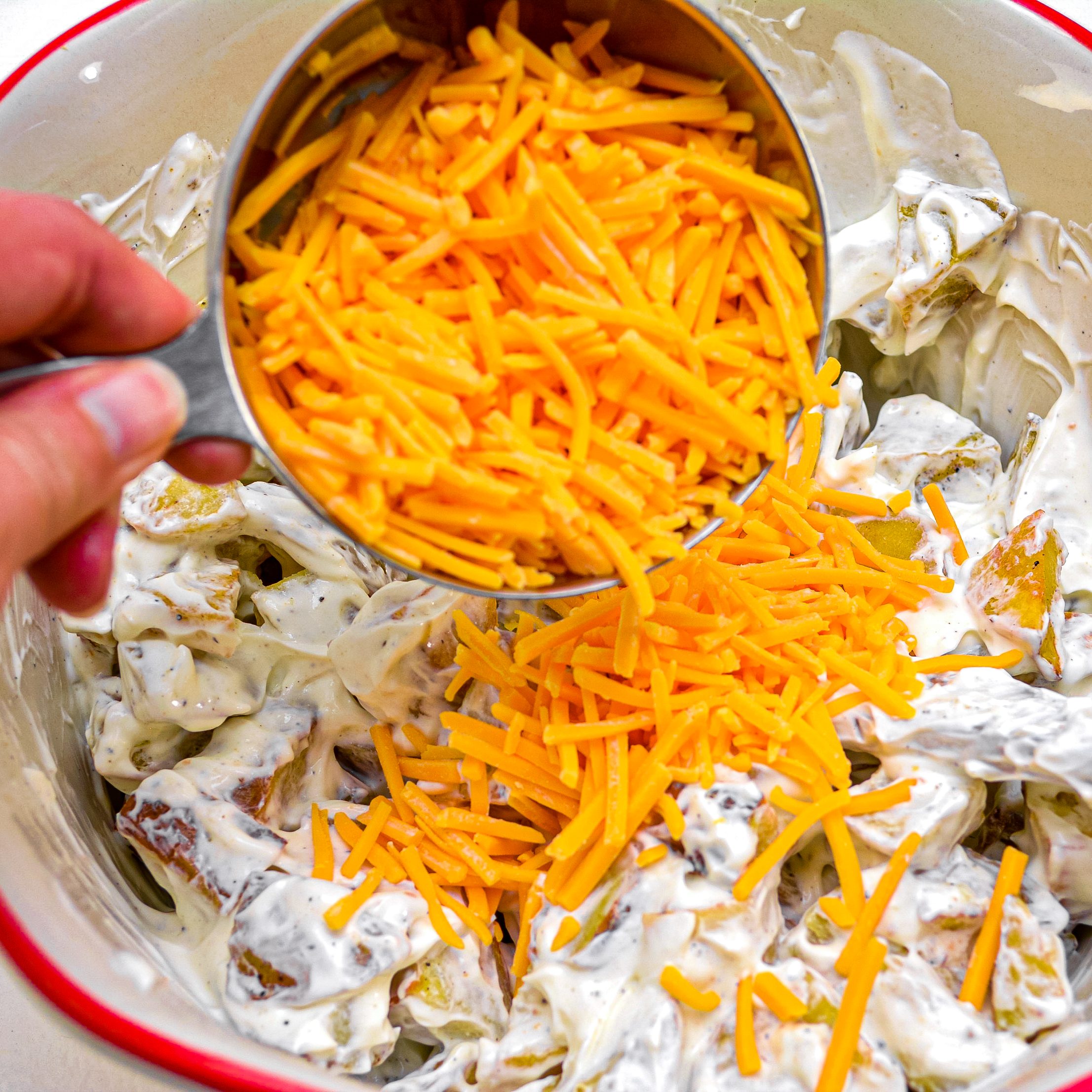 Add in 2 cups of shredded cheddar cheese.