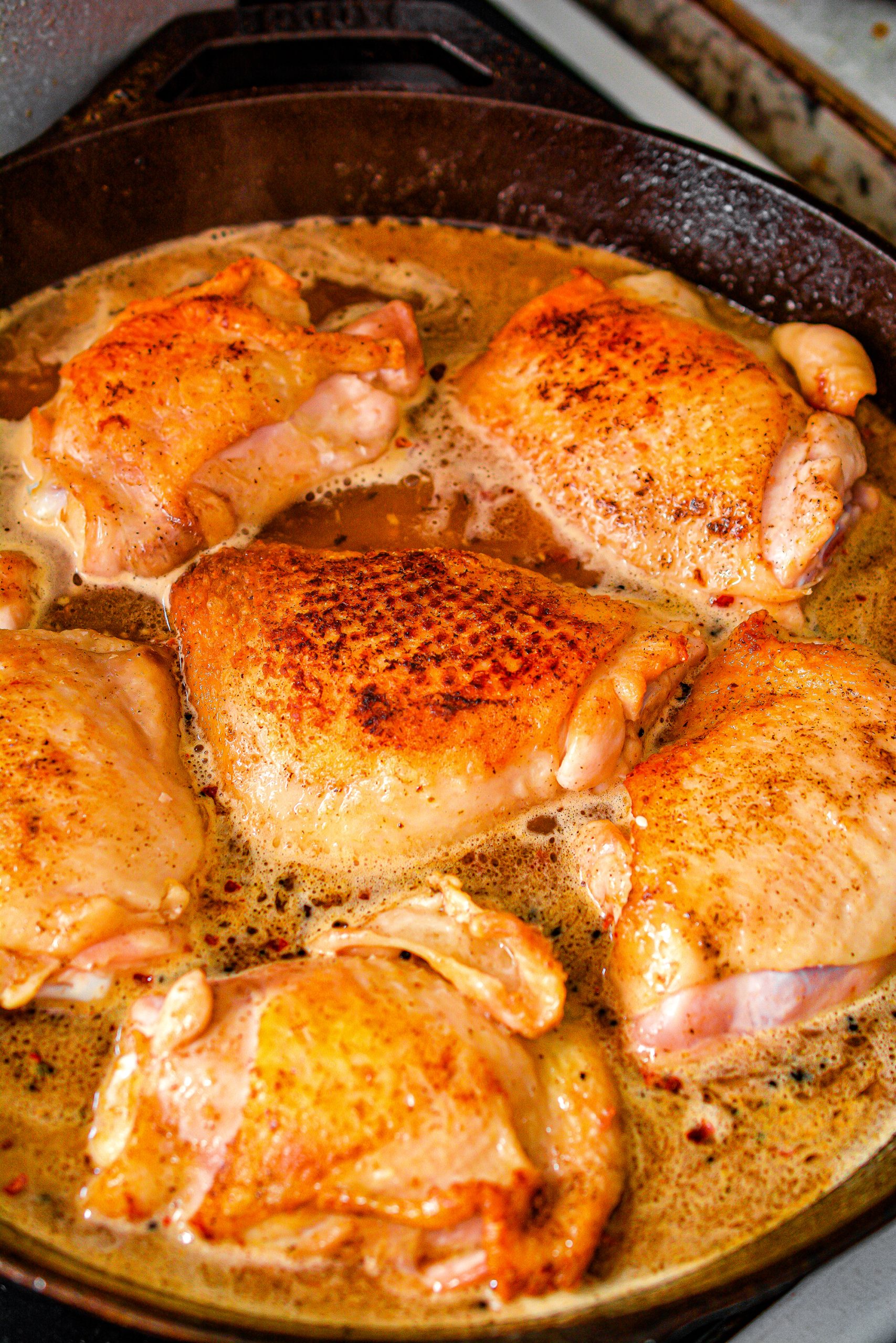 Return the chicken to the skillet along with the thyme, orange slices, and onion.