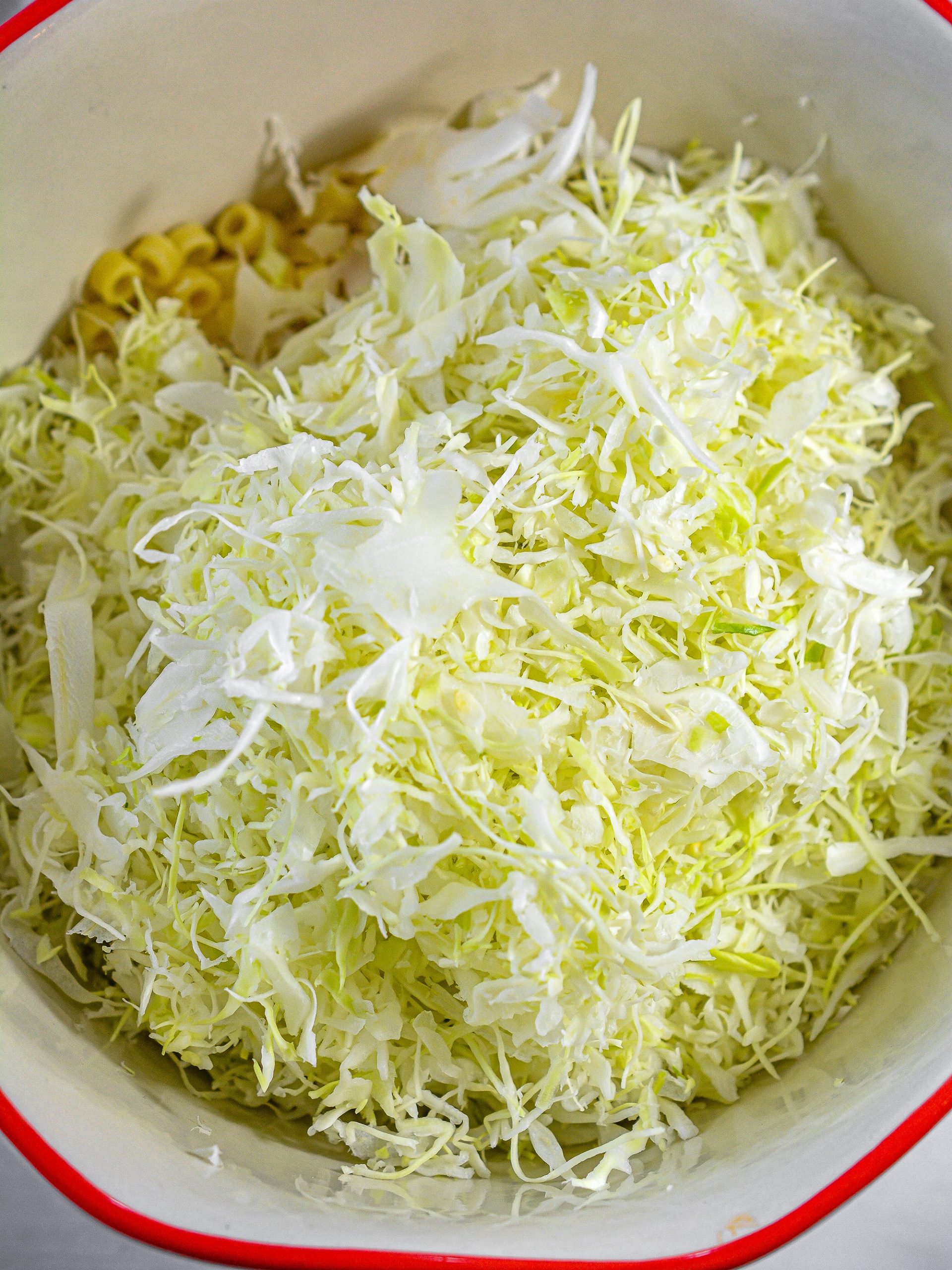 Then, add the shredded cabbage.