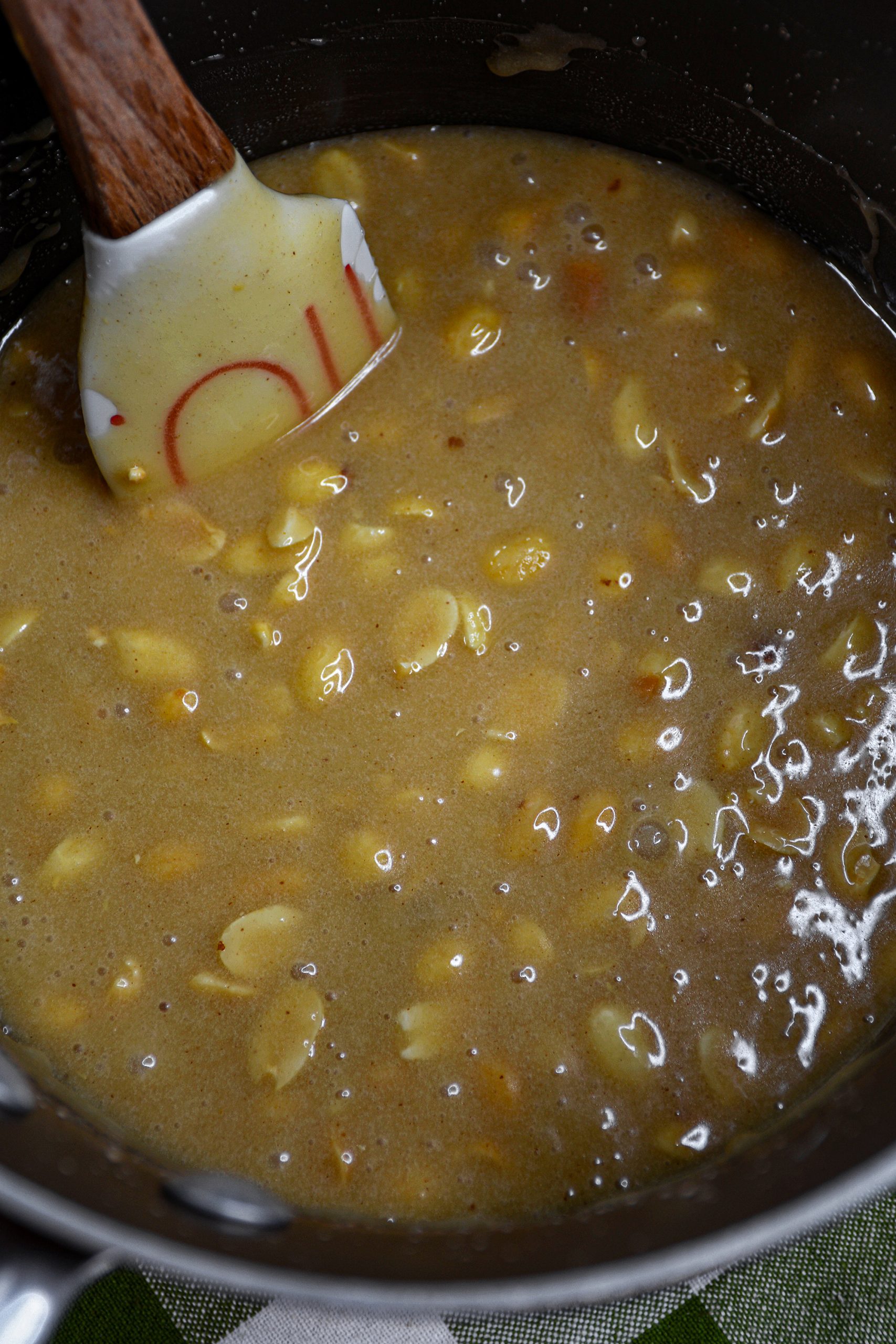 With a rubber spatula stir in the peanuts and cook for an additional 10 minutes constantly stirring.