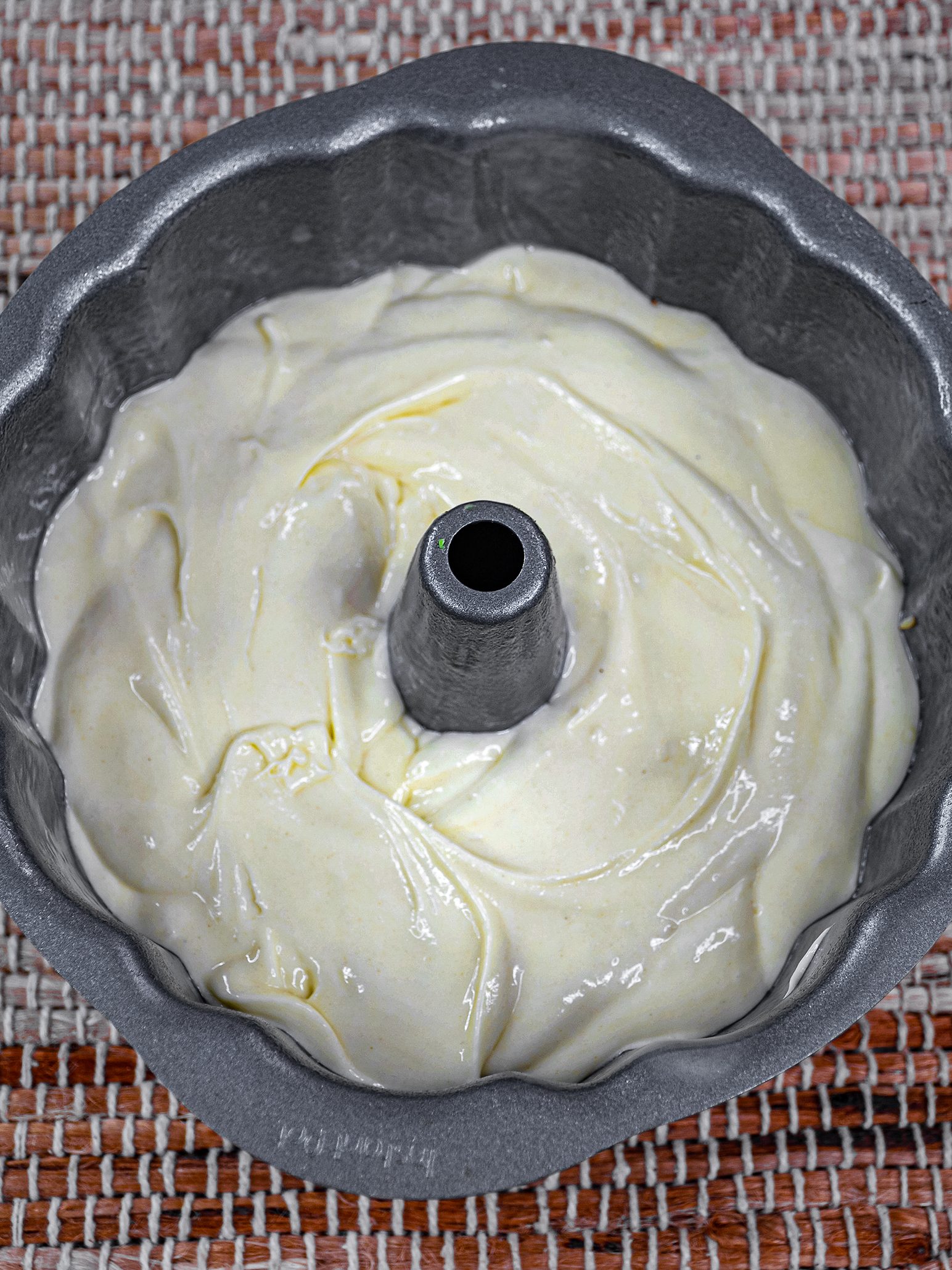 Pour the cake batter in the bundt cake pan.