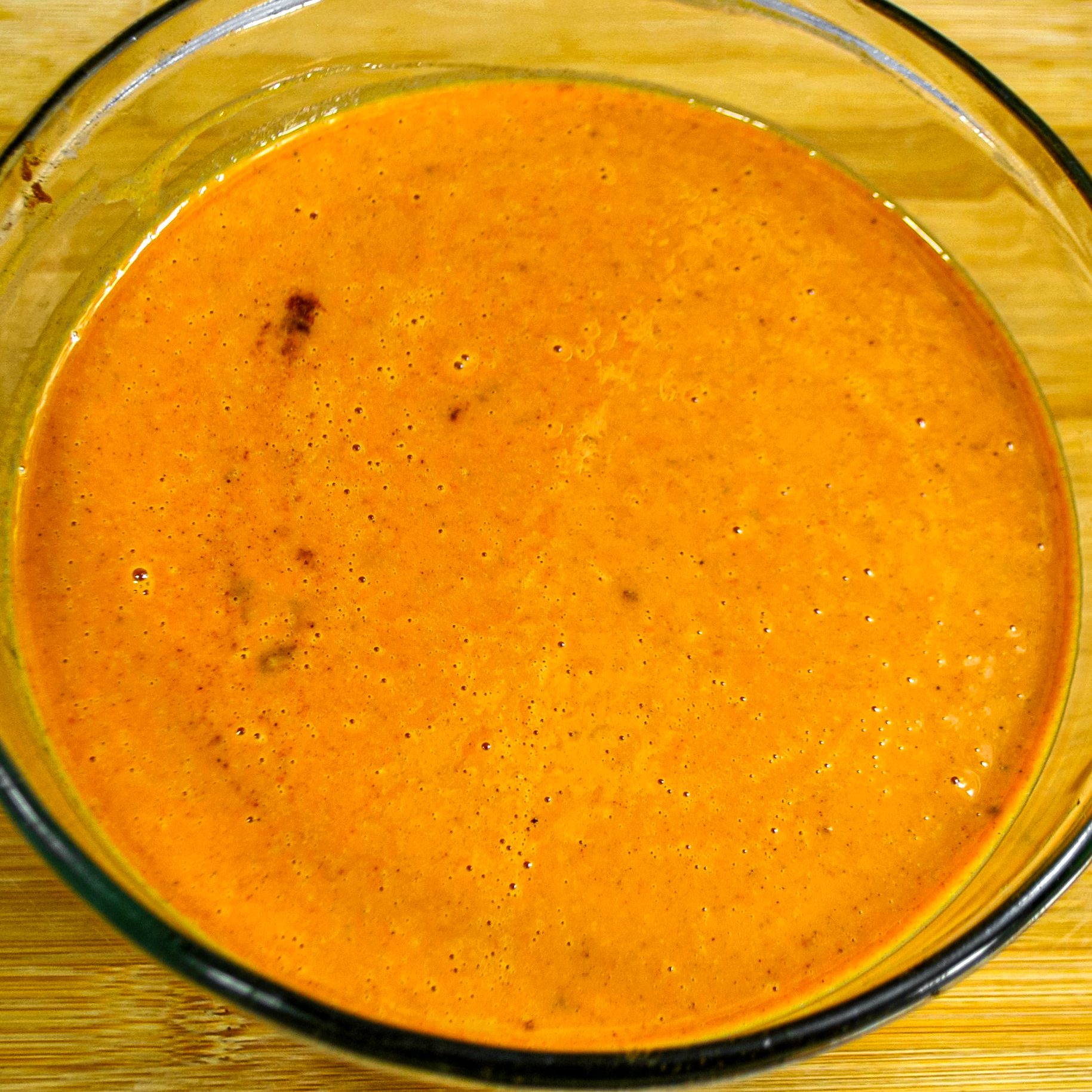 In a large mixing bowl, whisk together the pumpkin puree, evaporated milk, eggs, brown sugar, sugar, vanilla and pumpkin pie spice until smooth and combined