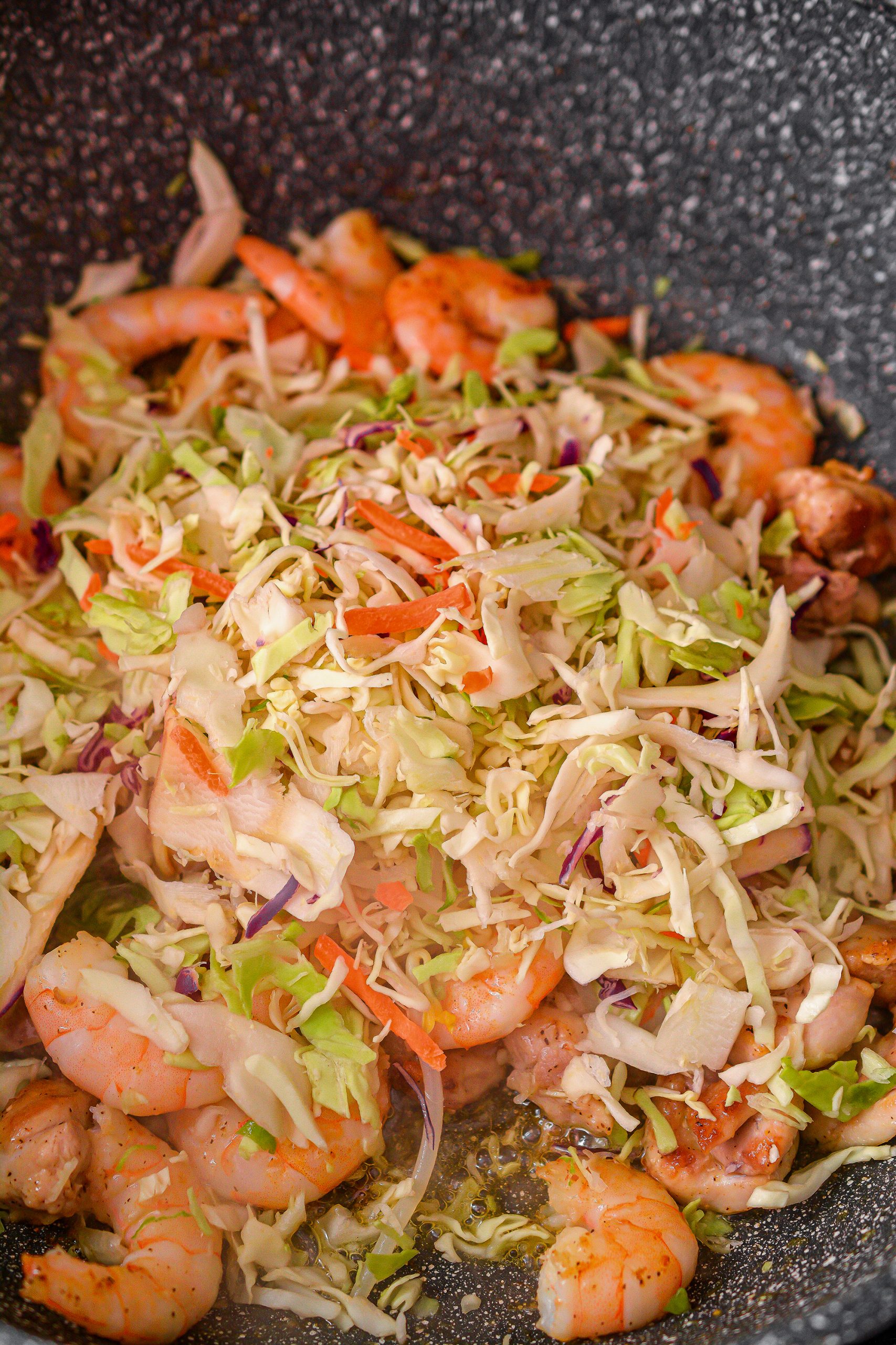 Reduce the heat to medium and stir in the coleslaw mix, bean sprouts and stir fry noodles.