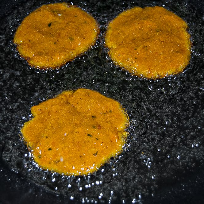 Once the oil is ready, add fritters about 3 or 4 at a time to the pan.