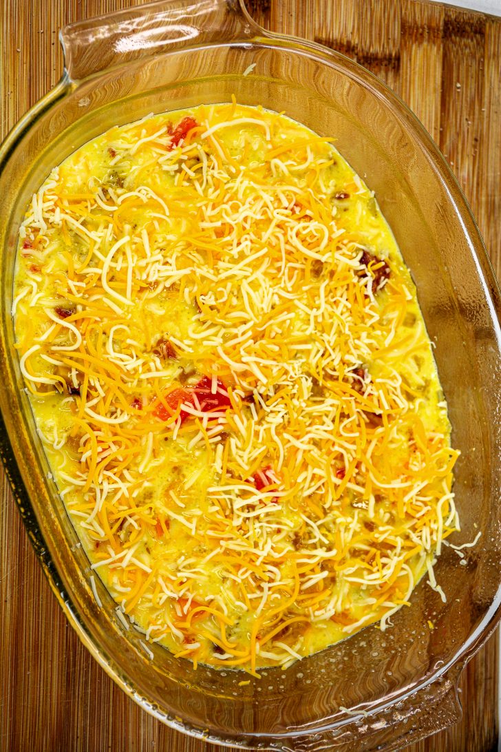 Cover the casserole with sharp cheddar cheese.