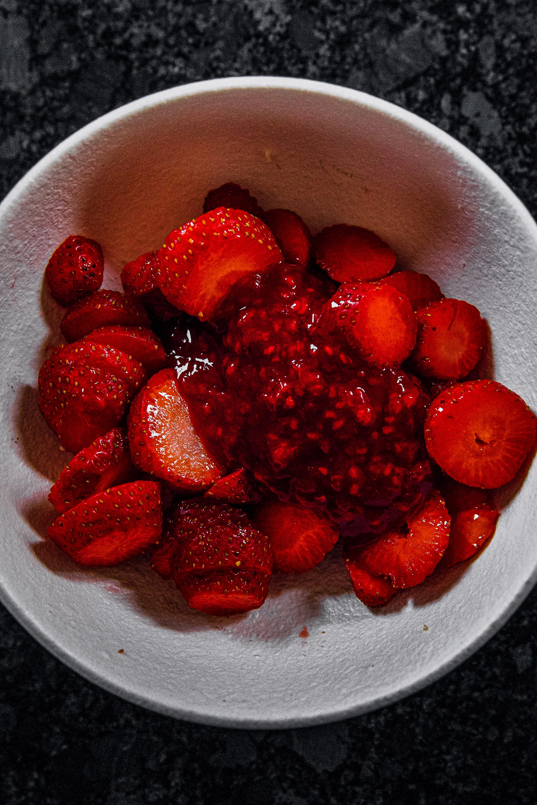 In a separate mixing bowl, add the glaze and strawberries