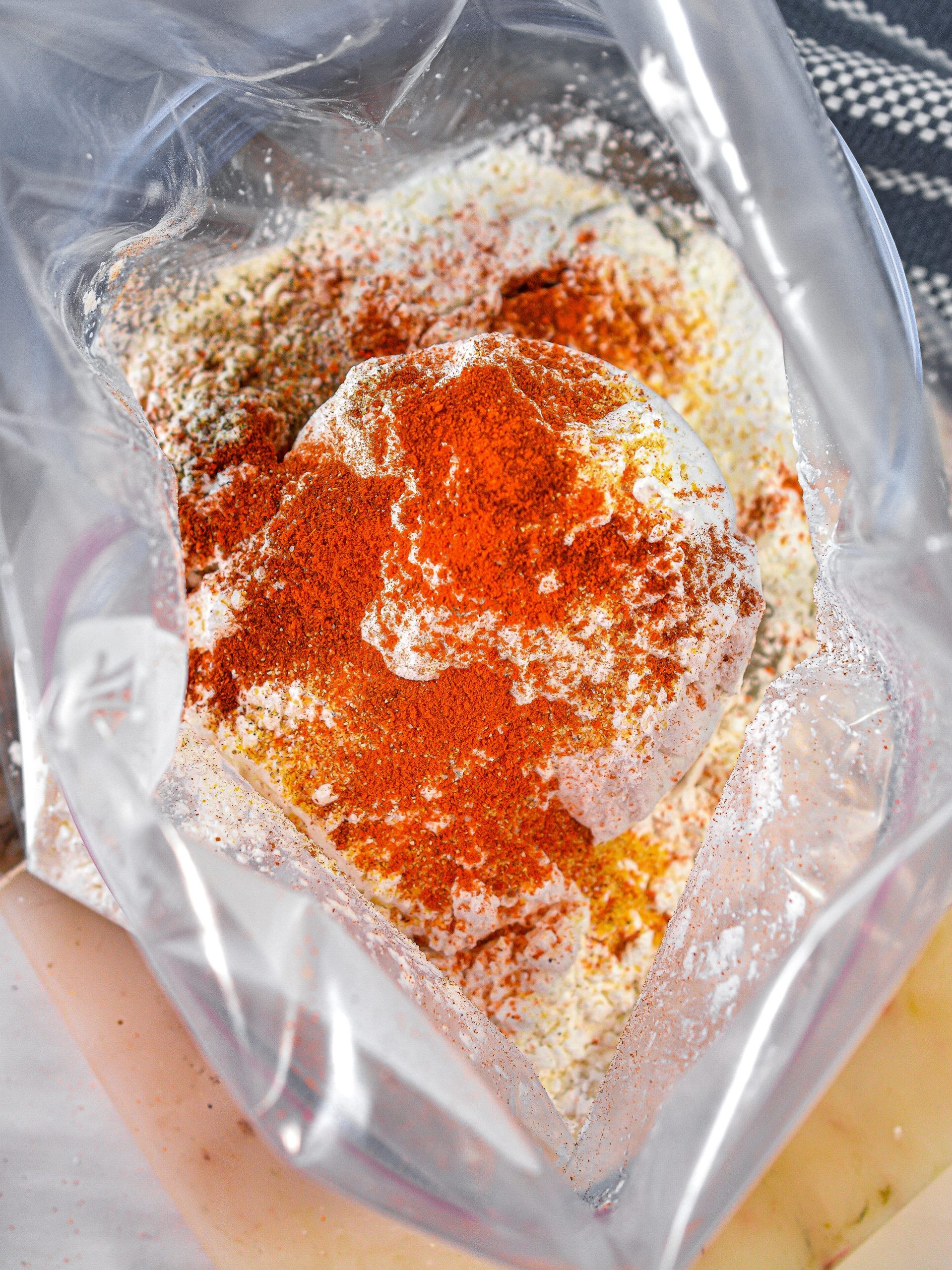 In a Ziploc bag, combine the flour, cornstarch and spices to taste. Shake to combine.