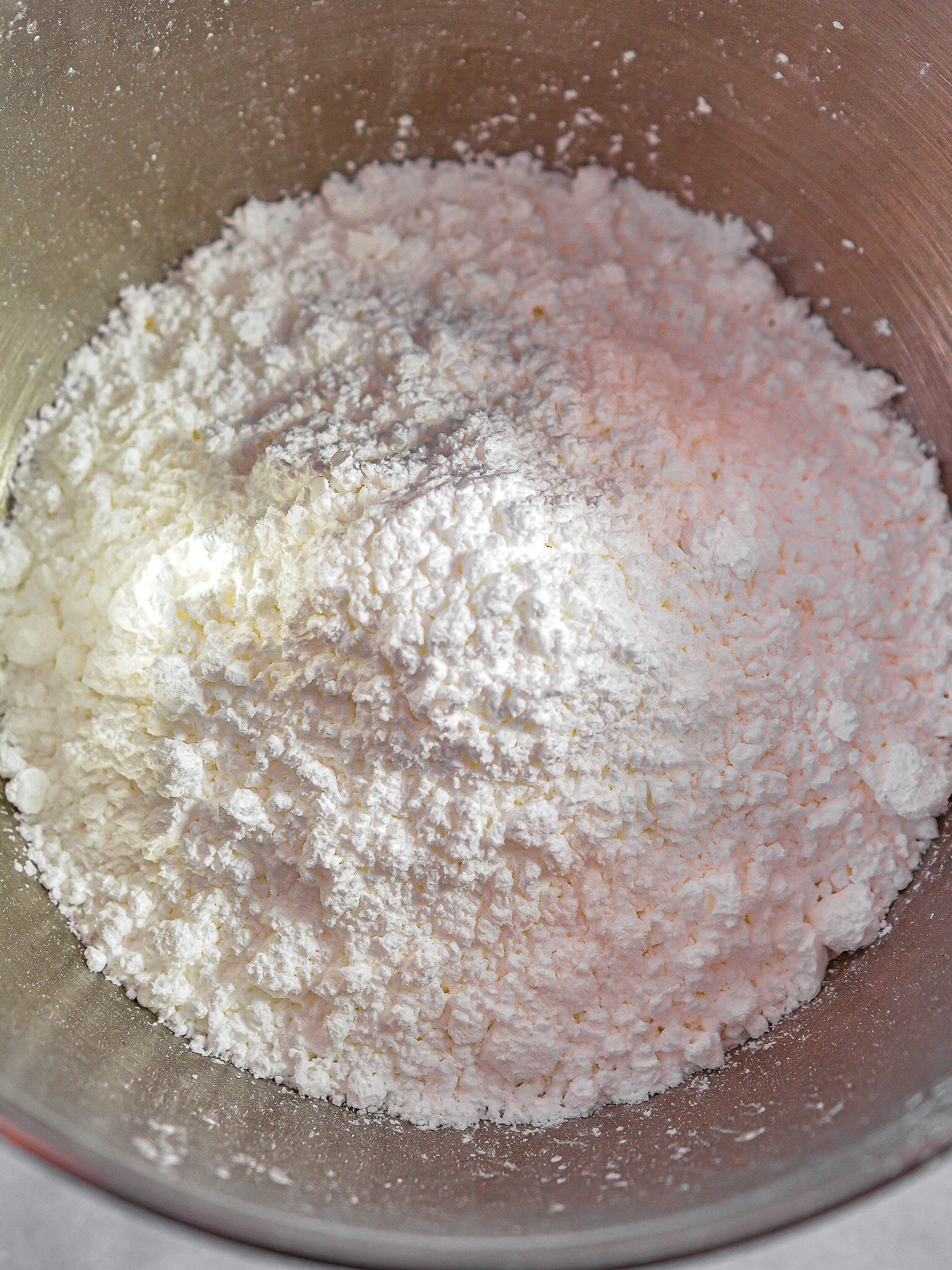 Adding the powdered sugar.
