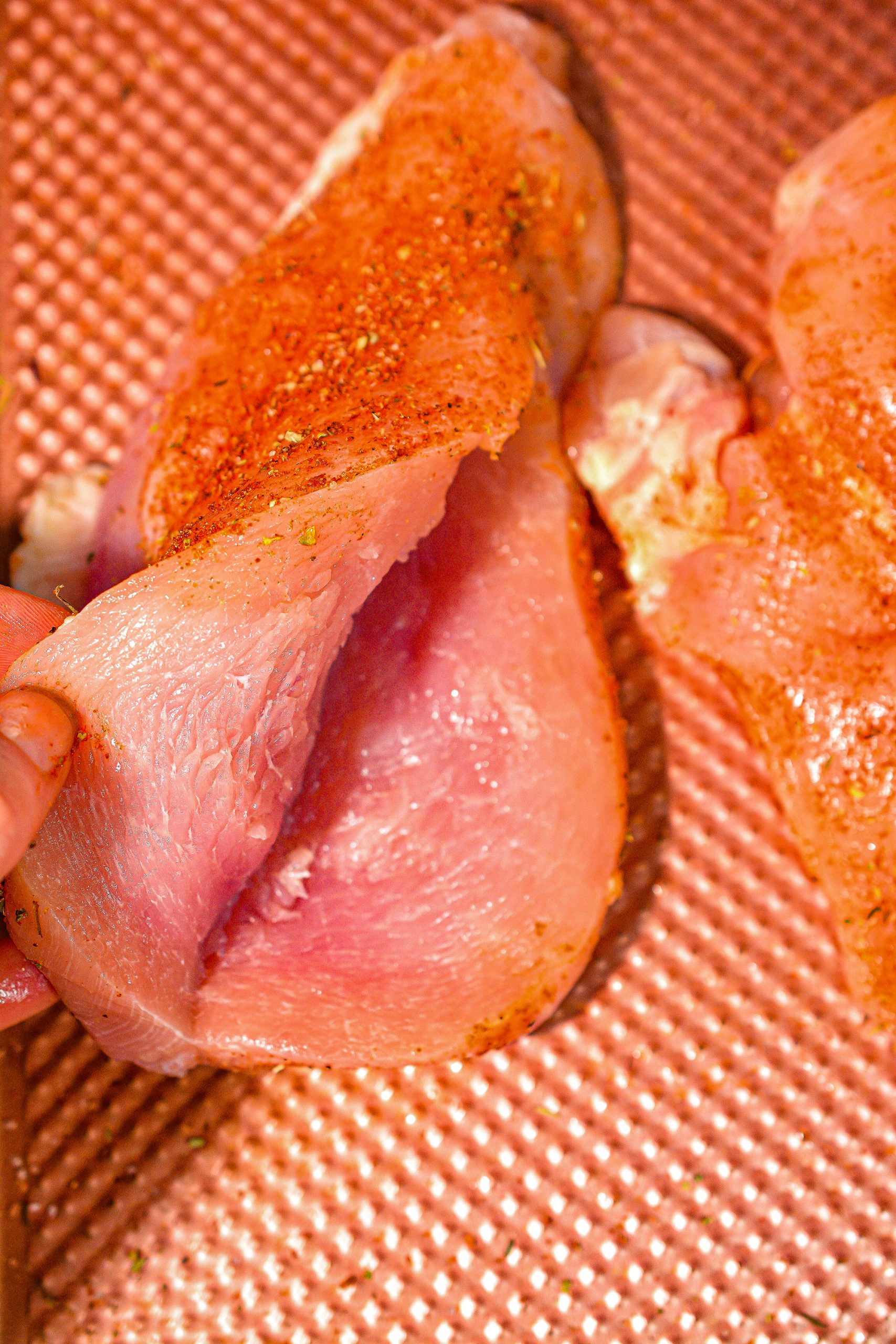 Slice pockets into the side of each chicken breast so that they can be stuffed.