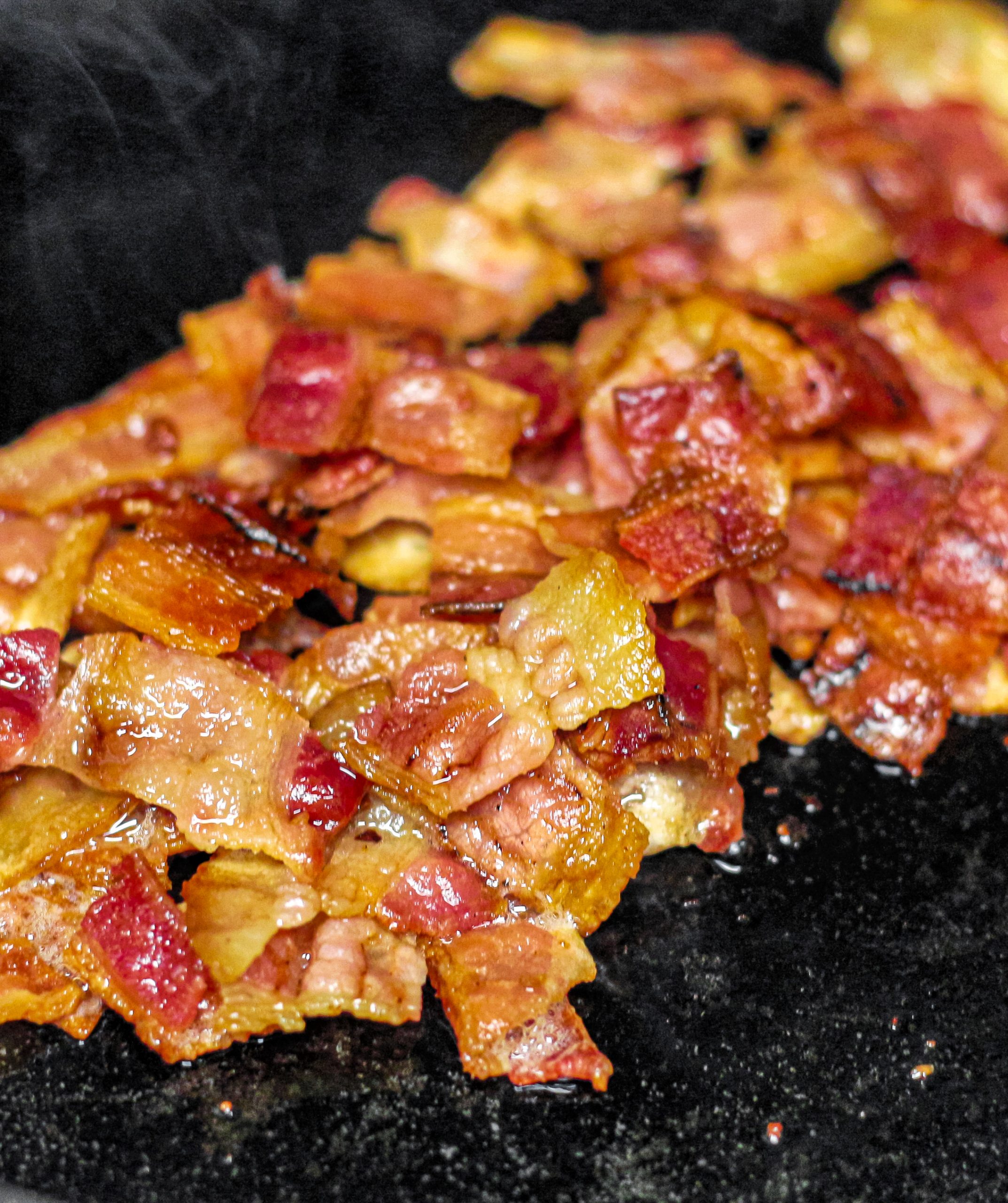 Using a large pan over medium heat, cook the bacon until crispy