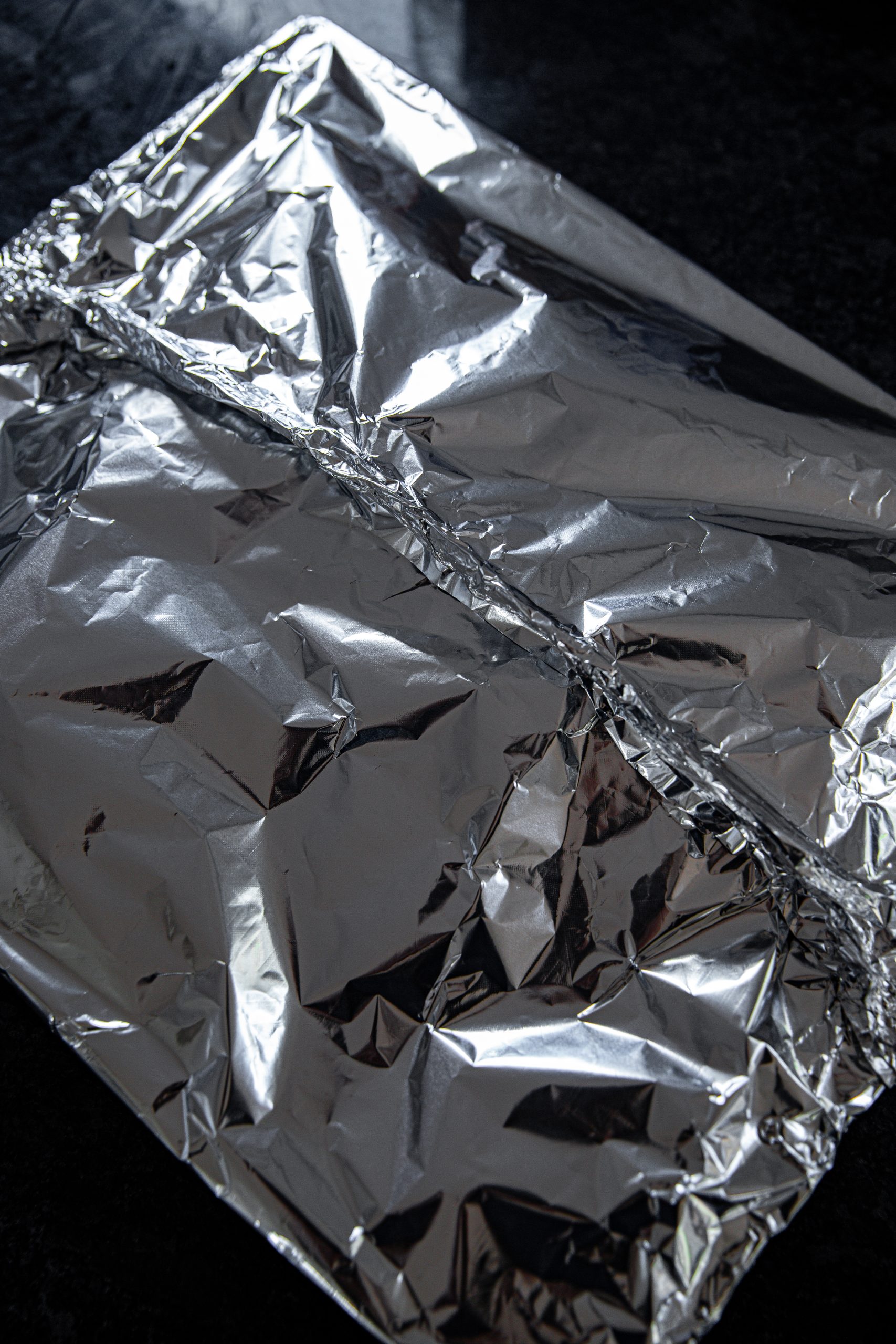 Place the ribs on the grate over the liquid and then make a foil tent over top.