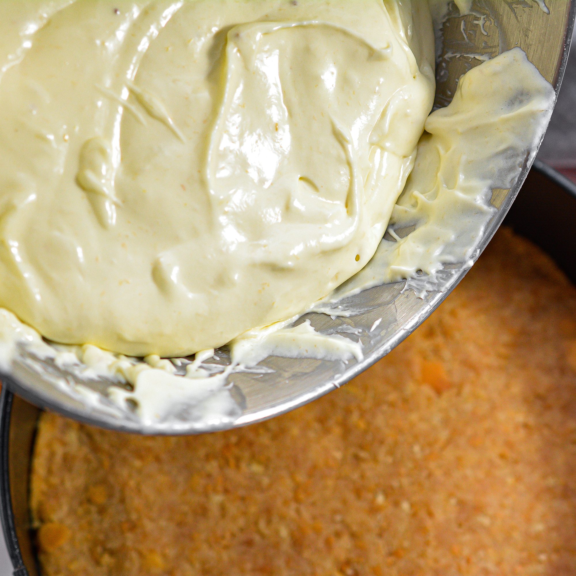 Spread the cheesecake mixture on top of the crust and bake for 90 minutes.