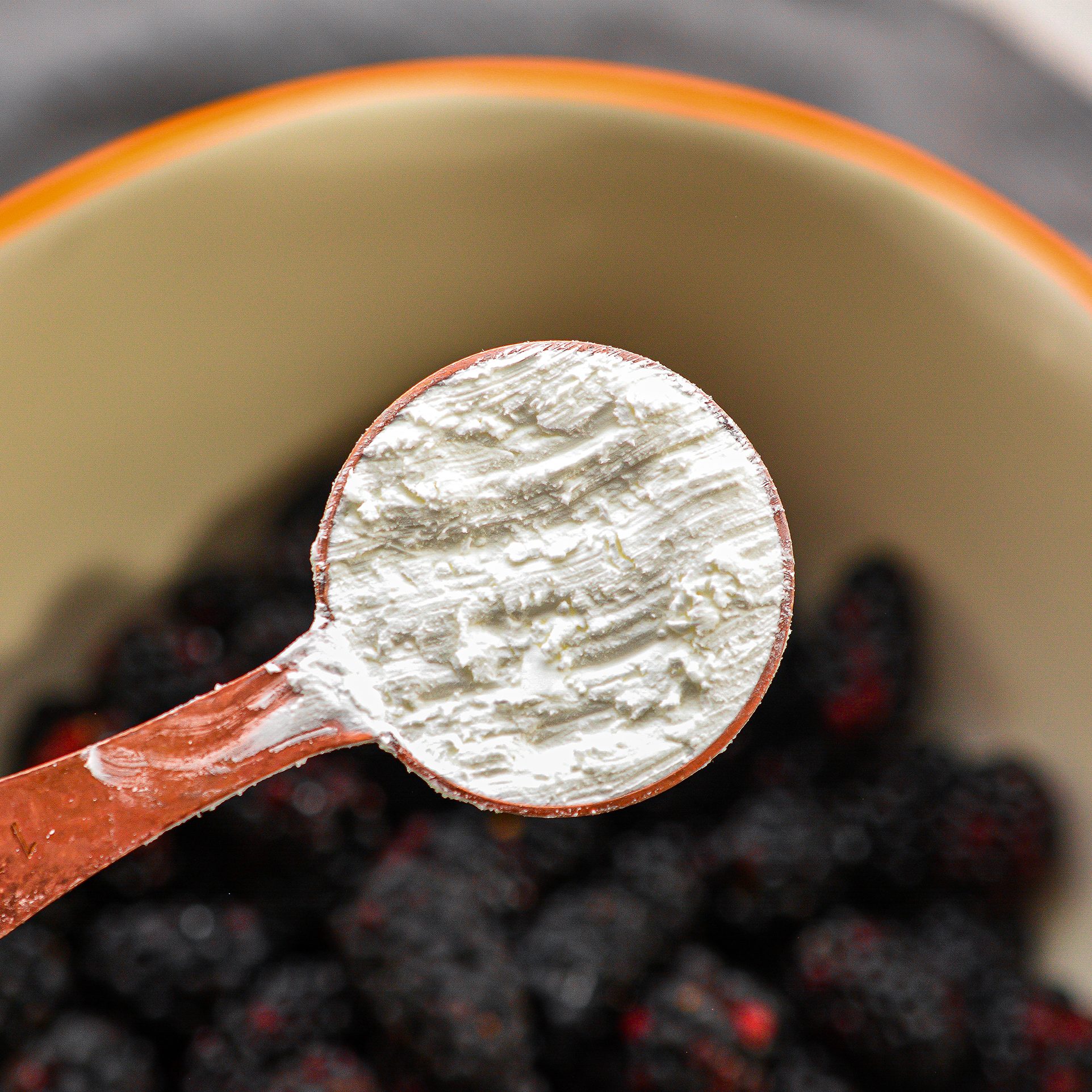 Add the berries, cornstarch, and ½ cup sugar to a mixing bowl and toss to coat. Drizzle the ¼ cup of melted butter over the berries and stir to combine.