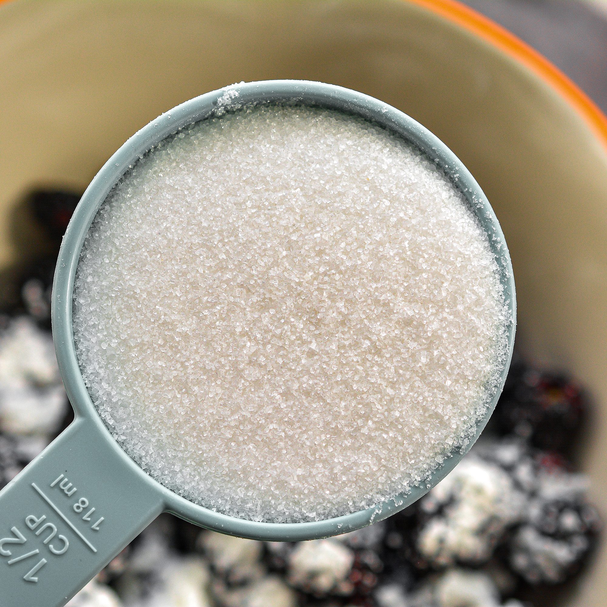 Add the berries, cornstarch, and ½ cup sugar to a mixing bowl and toss to coat. Drizzle the ¼ cup of melted butter over the berries and stir to combine.
