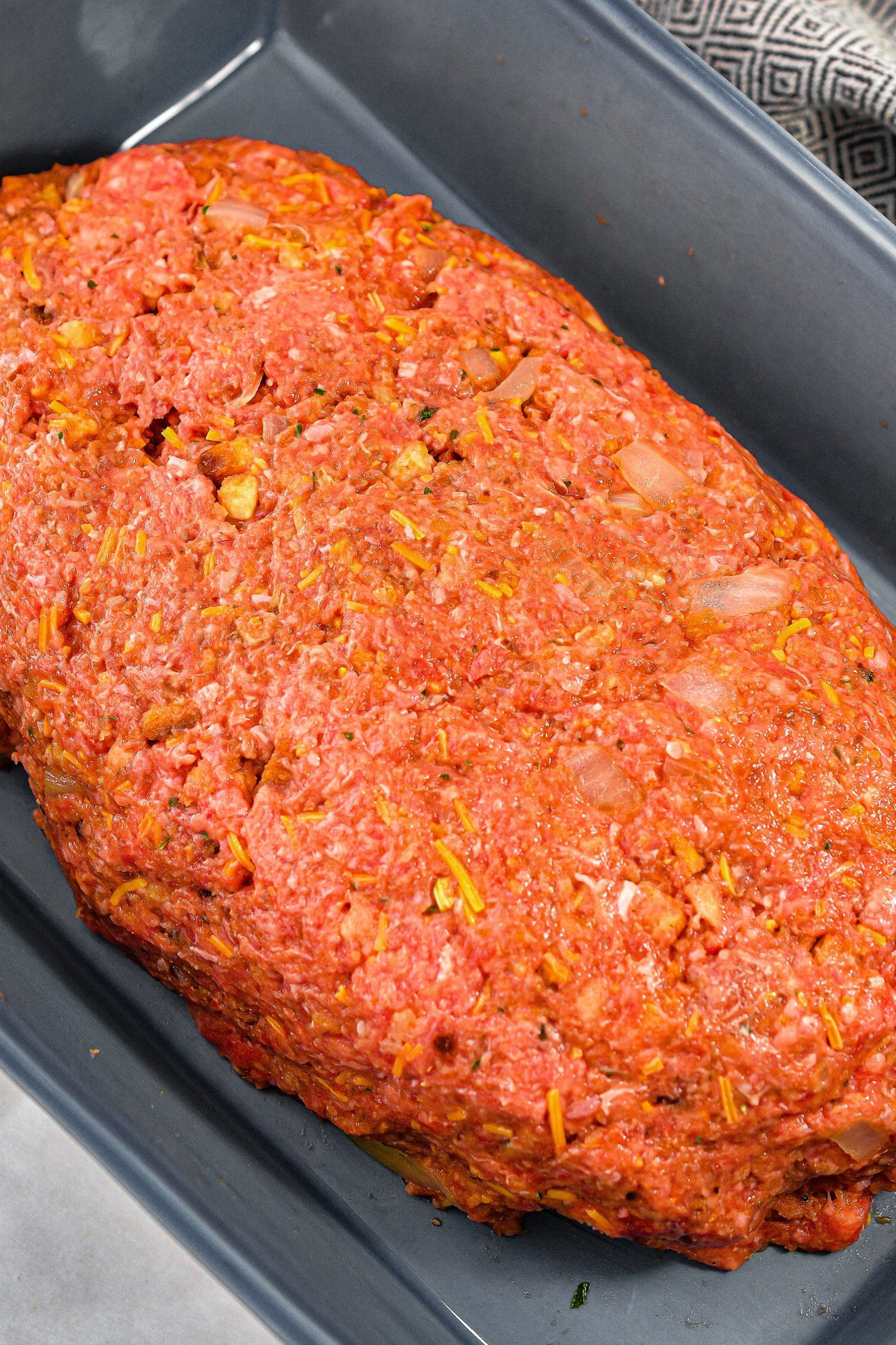 Form the meat mixture into a loaf shape in a 9x13 baking dish.