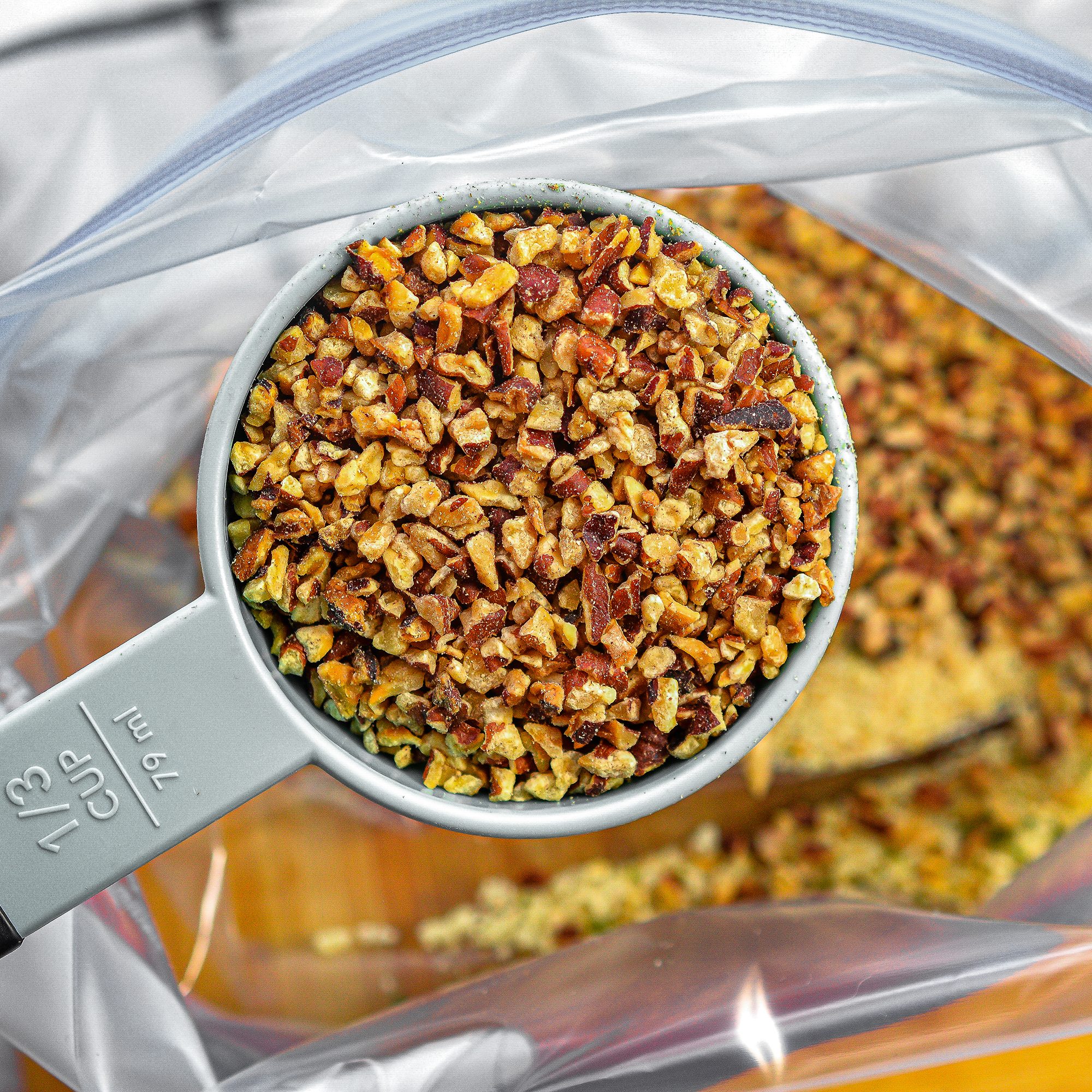 Place ⅔ cup of the chopped pecans into a Ziploc bag with the breadcrumbs and shake to combine.