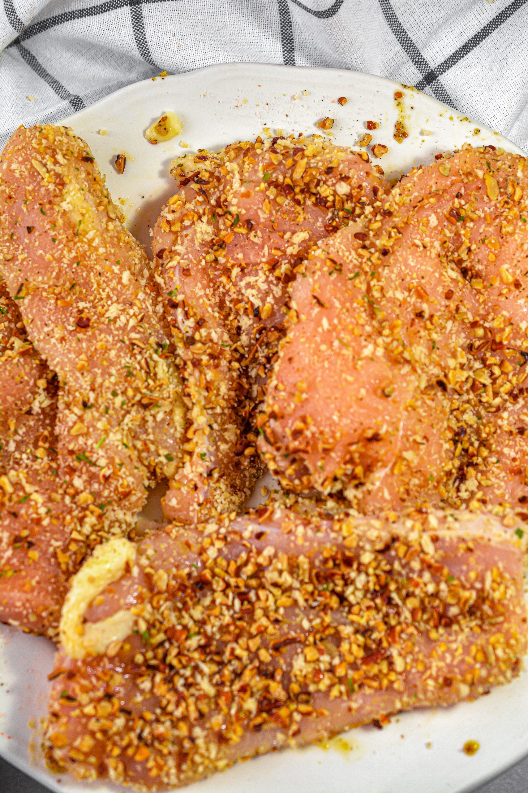 Place the chicken breasts into the Ziploc bag and coat well in the pecan mixture.