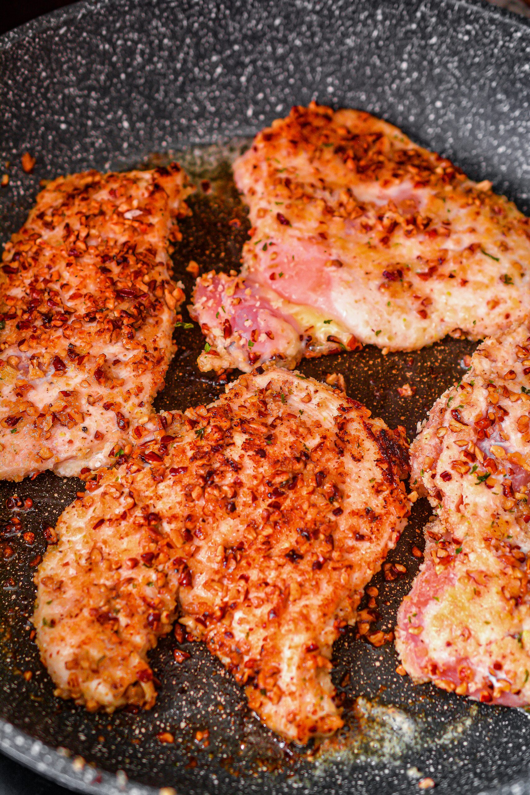 Sear the chicken for several minutes on each side until browned.