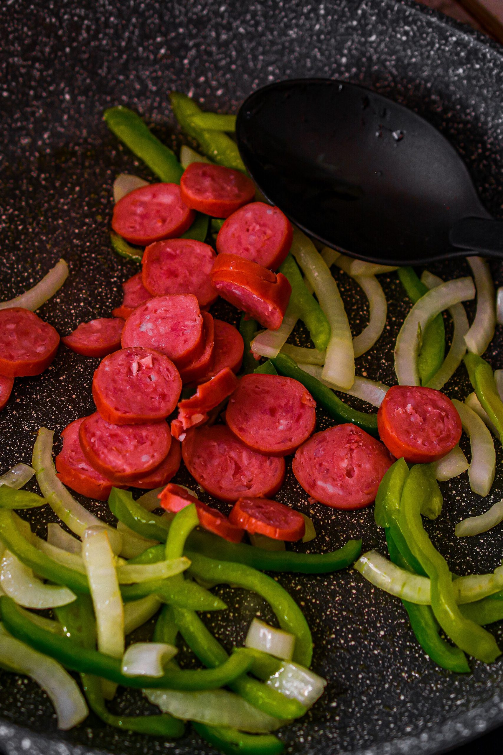 Mix the smoked sausage into the skillet and heat until warmed through. Set aside the vegetable and sausage mixture.