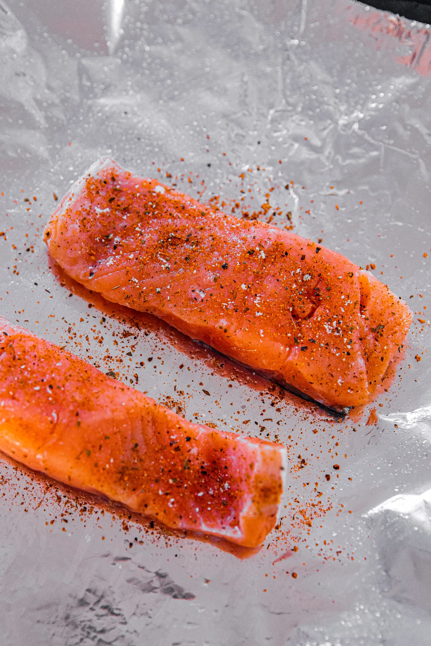  Pat the salmon dry with paper towels and place on the foil. 