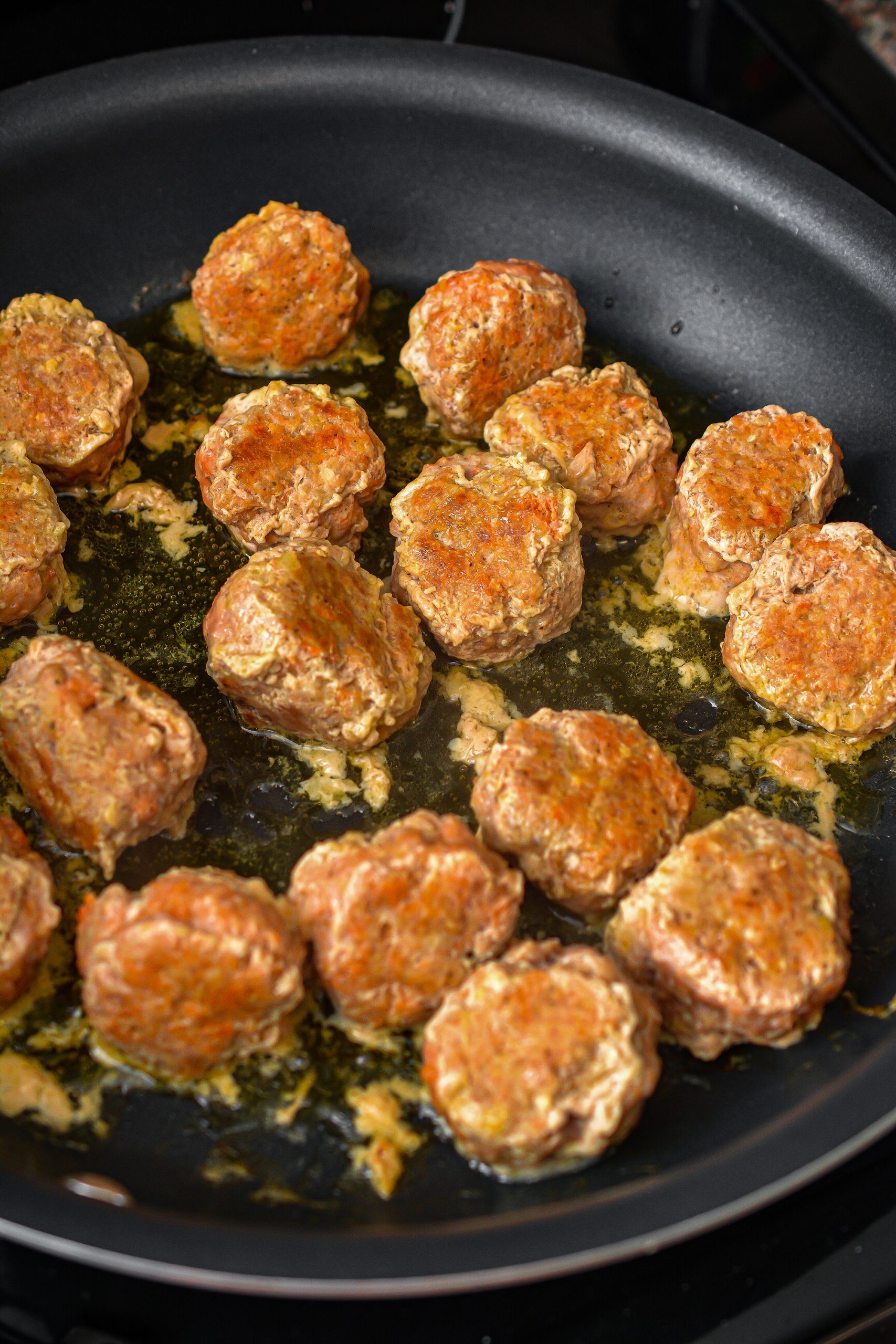 Mix together the ingredients for the meatballs, and mix with your hands until completely combined.