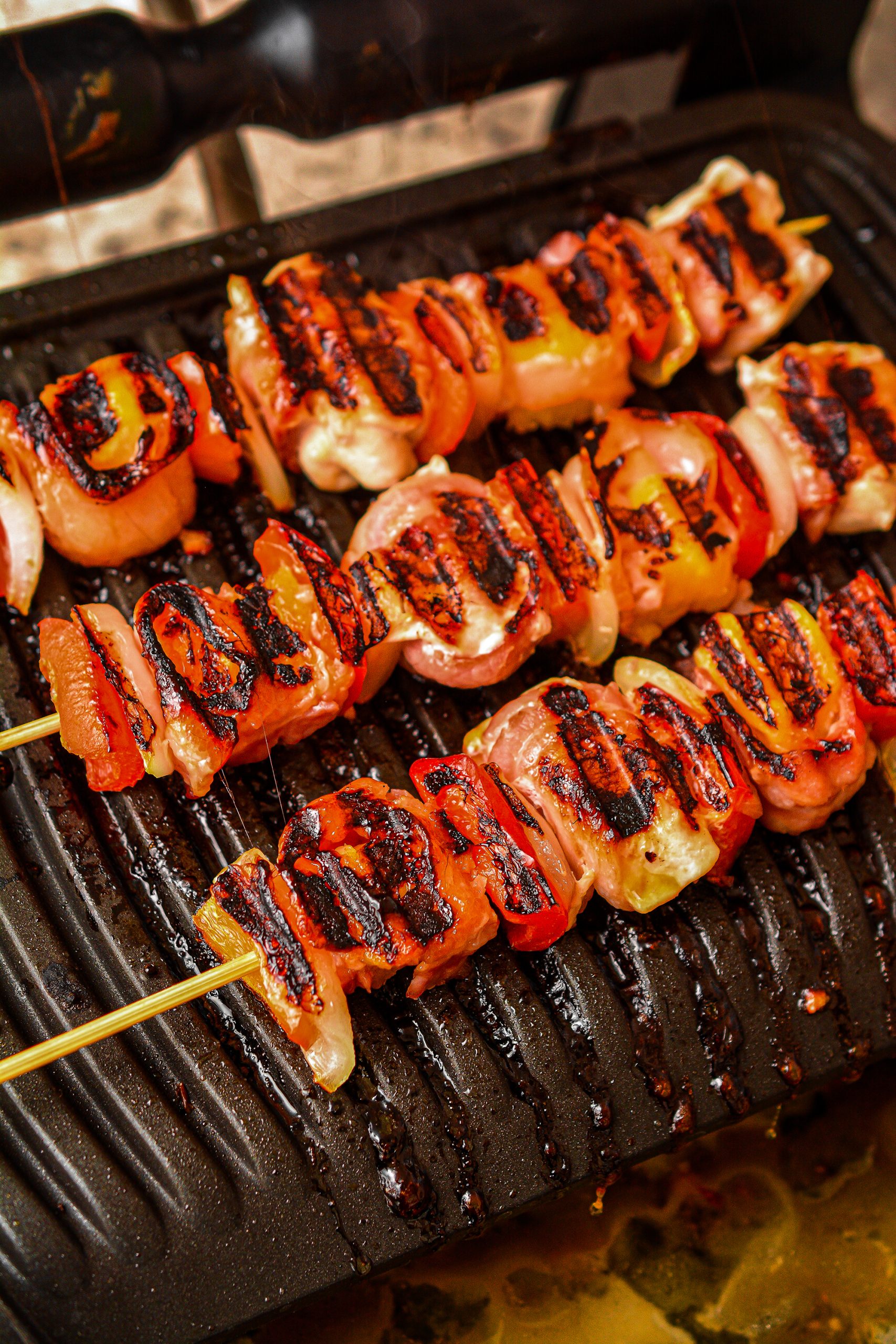 Grill until the chicken is cooked through and the bacon is crispy.