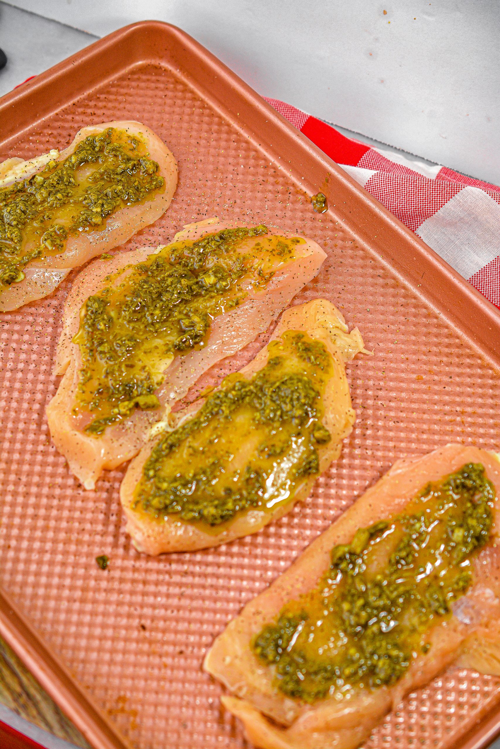 Top each piece of chicken with a teaspoon of the pesto.  Bake for 15 minutes