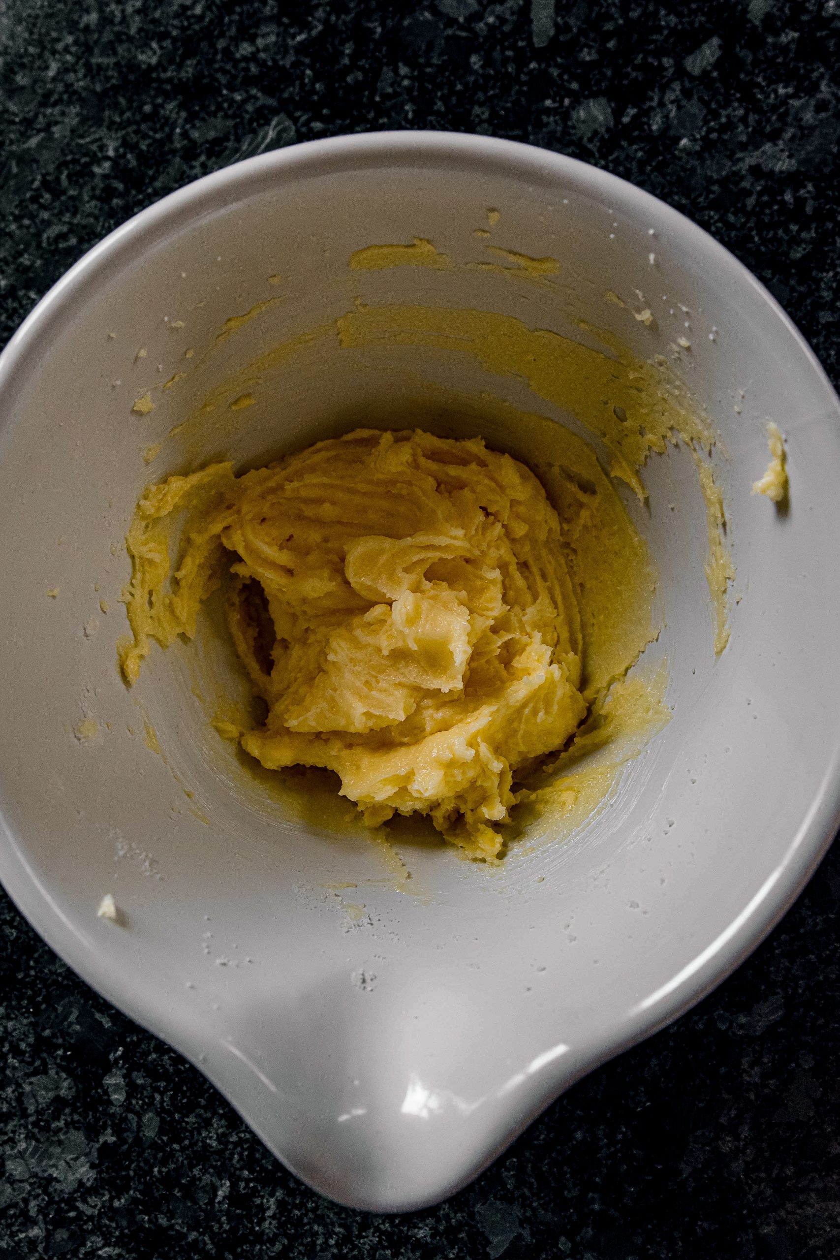 Use a mixer and combine butter, cream cheese and sugar in a large bowl. Beat in eggs, one at a time and vanilla.
