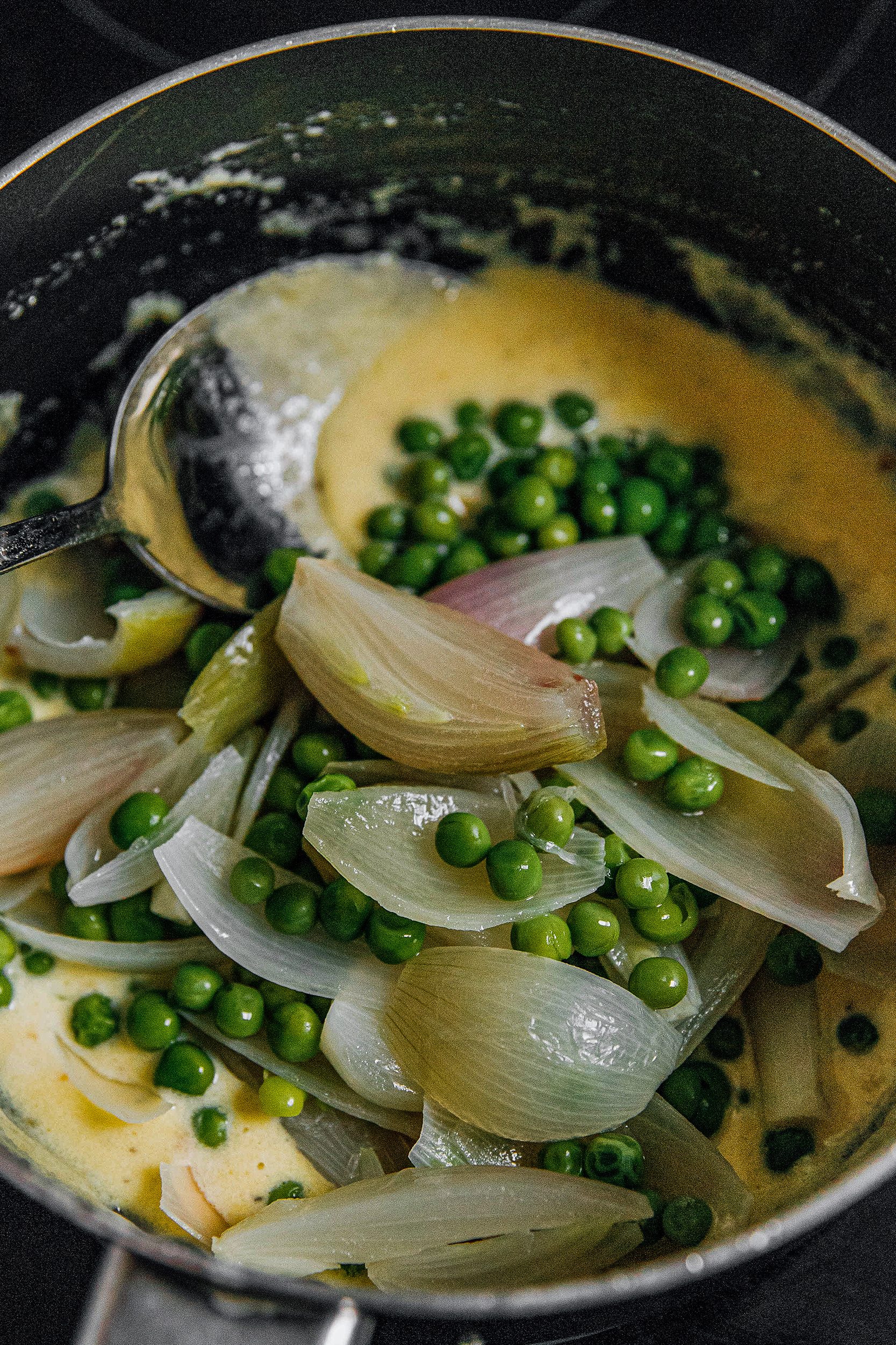 Add onions and peas back into saucepan and stir into the sauce to coat. Serve immediately.