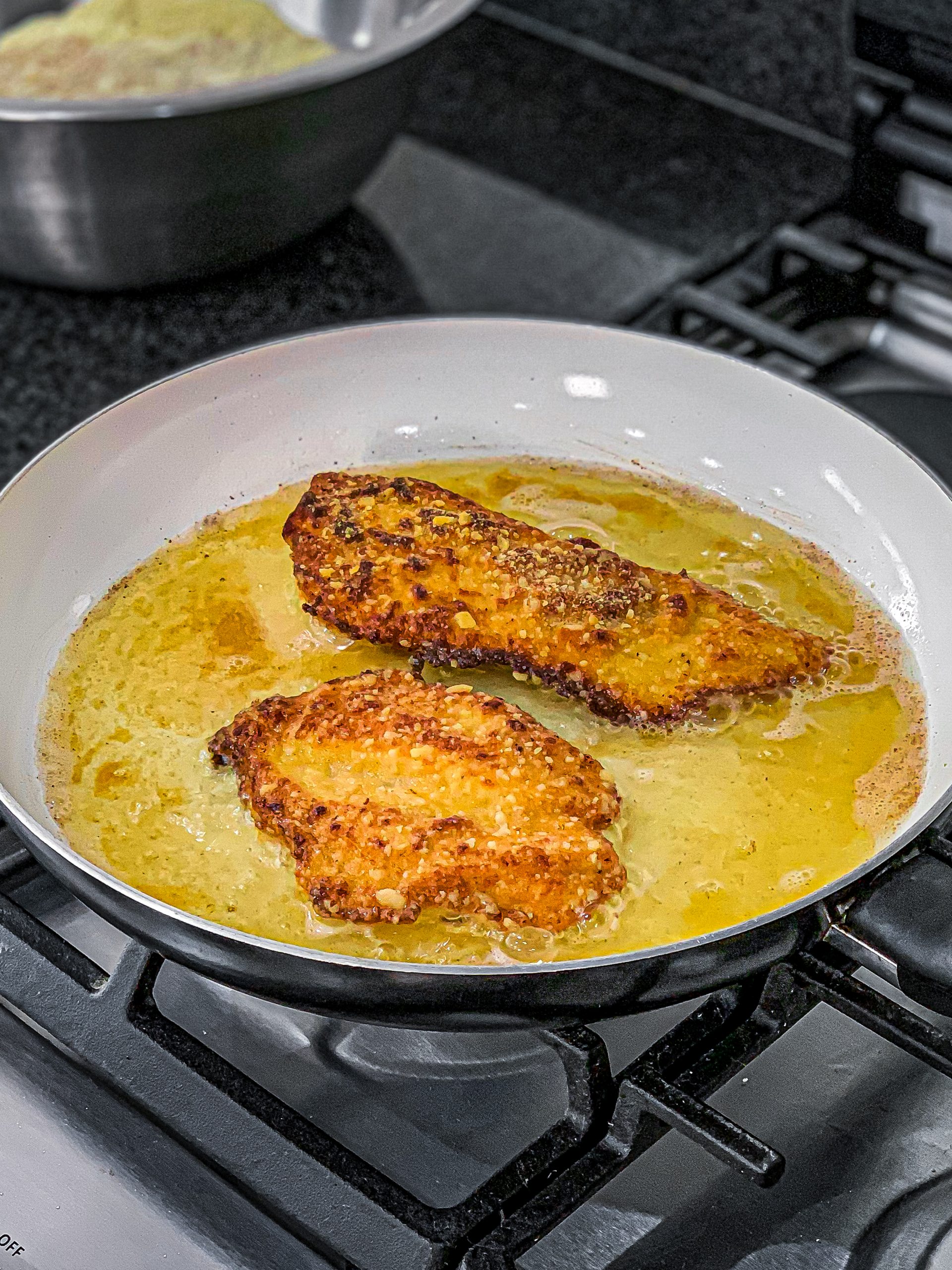 Place the fried chicken on a plate lined with paper towels to drain excess oil.