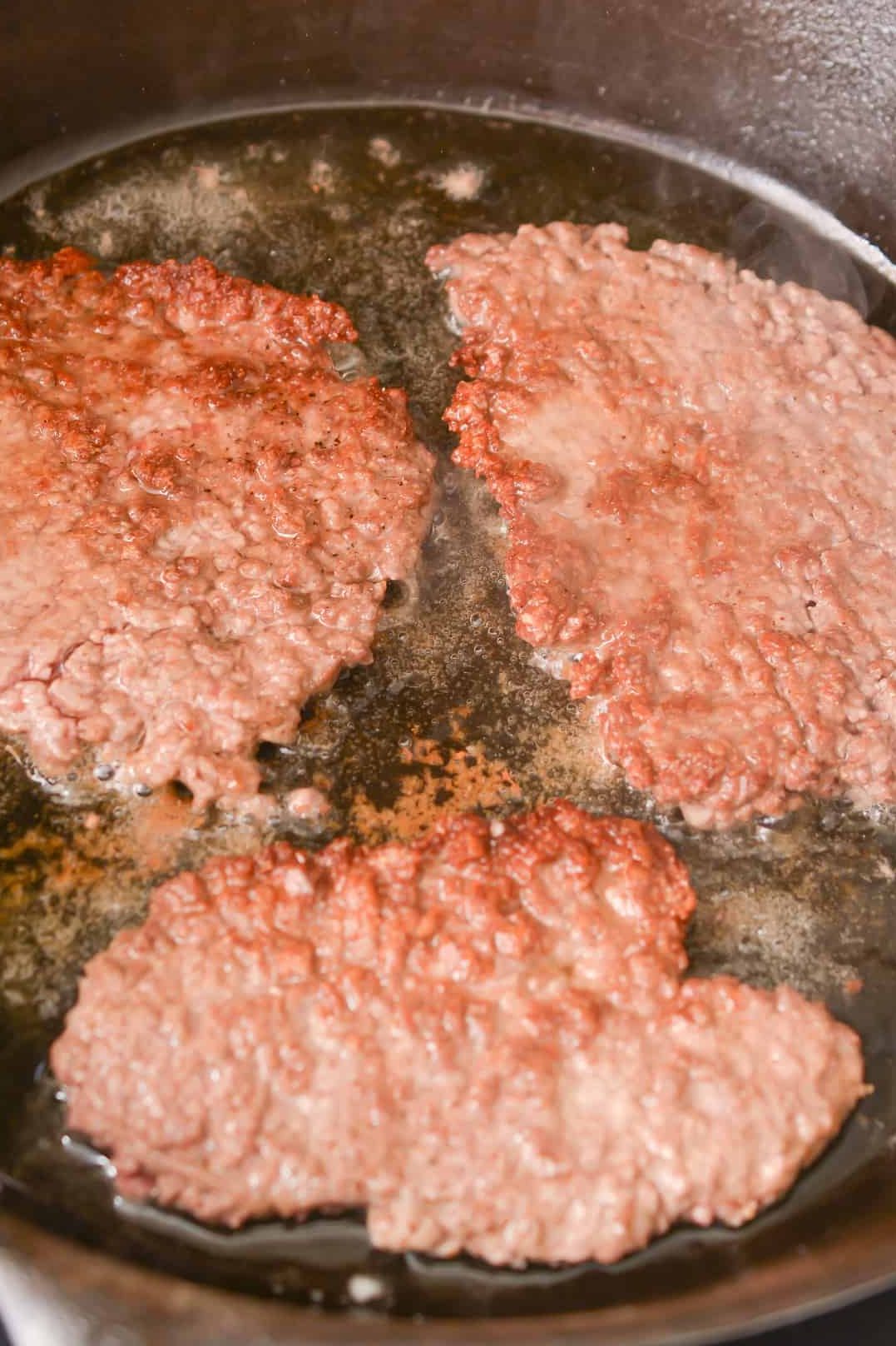 Add the cube steaks to the heated skillet, and sear well on all sides.