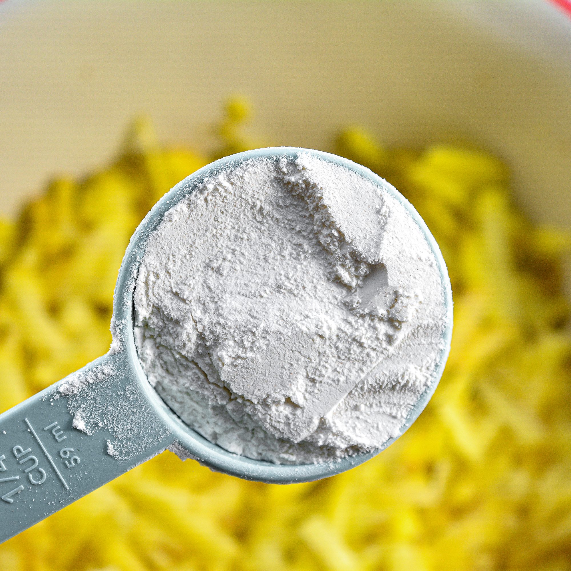 In a large mixing bowl, combine the shredded potato, 3 eggs, ½ cup flour, garlic powder, and salt and pepper to taste.