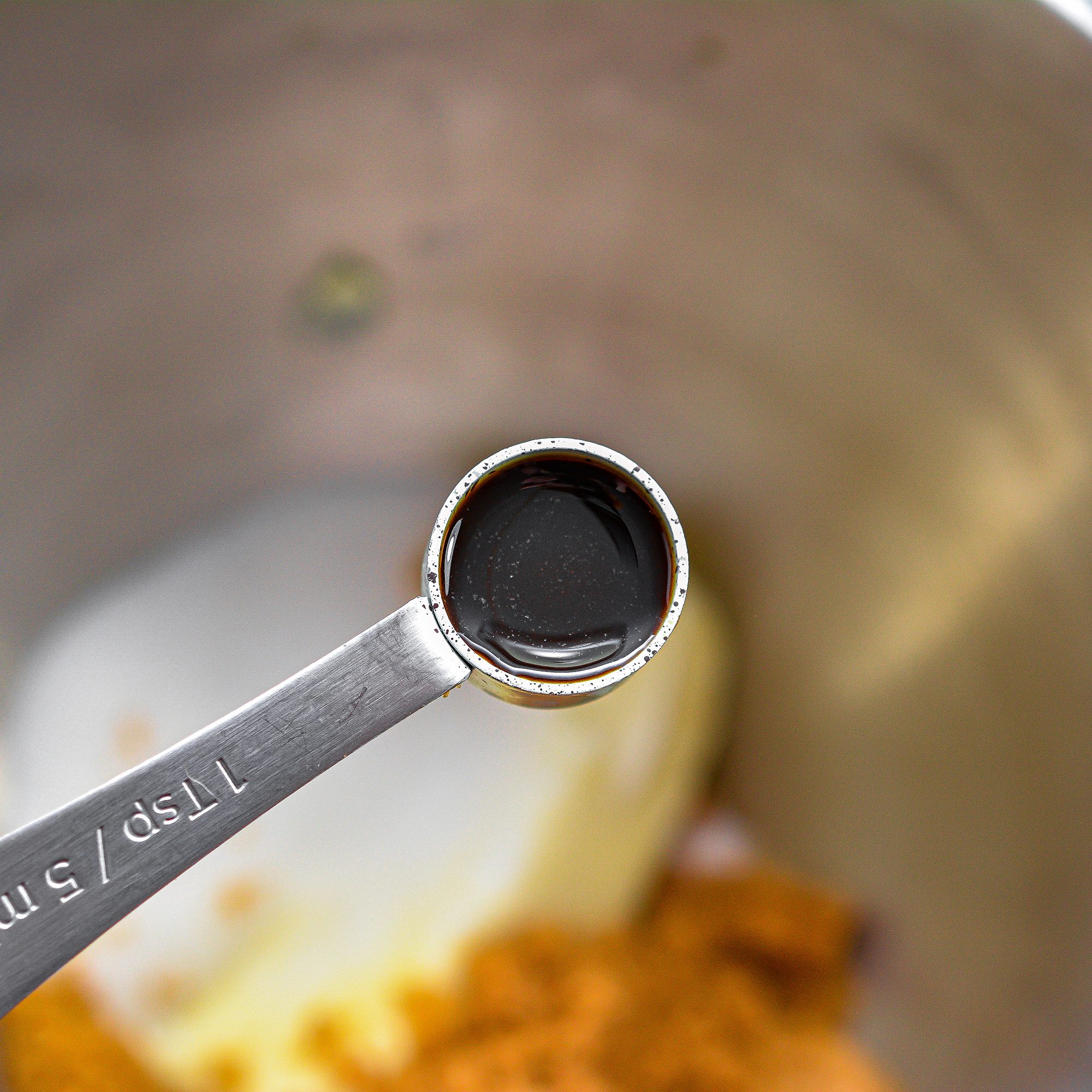 In a mixing bowl, blend together the sugars, butter and vanilla until creamy.