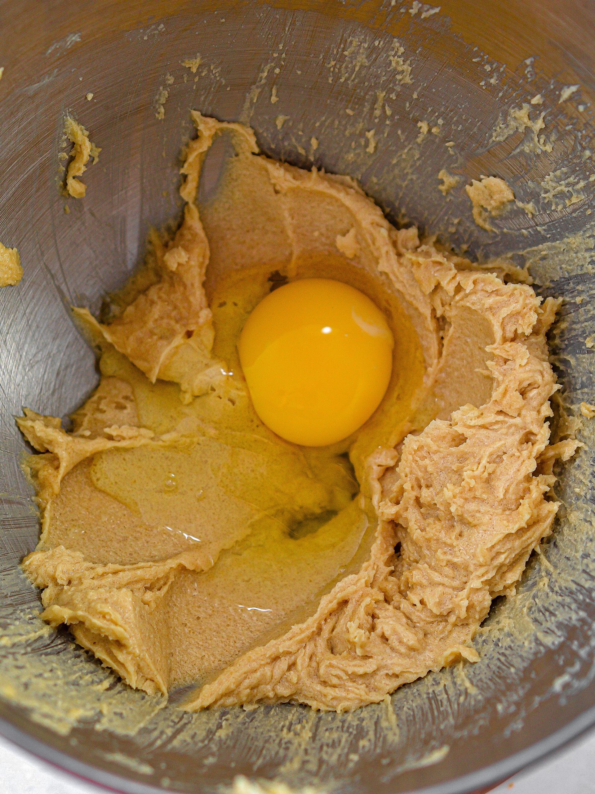 Mix in the peanut butter, egg, salt, baking soda and flour until a smooth batter forms.