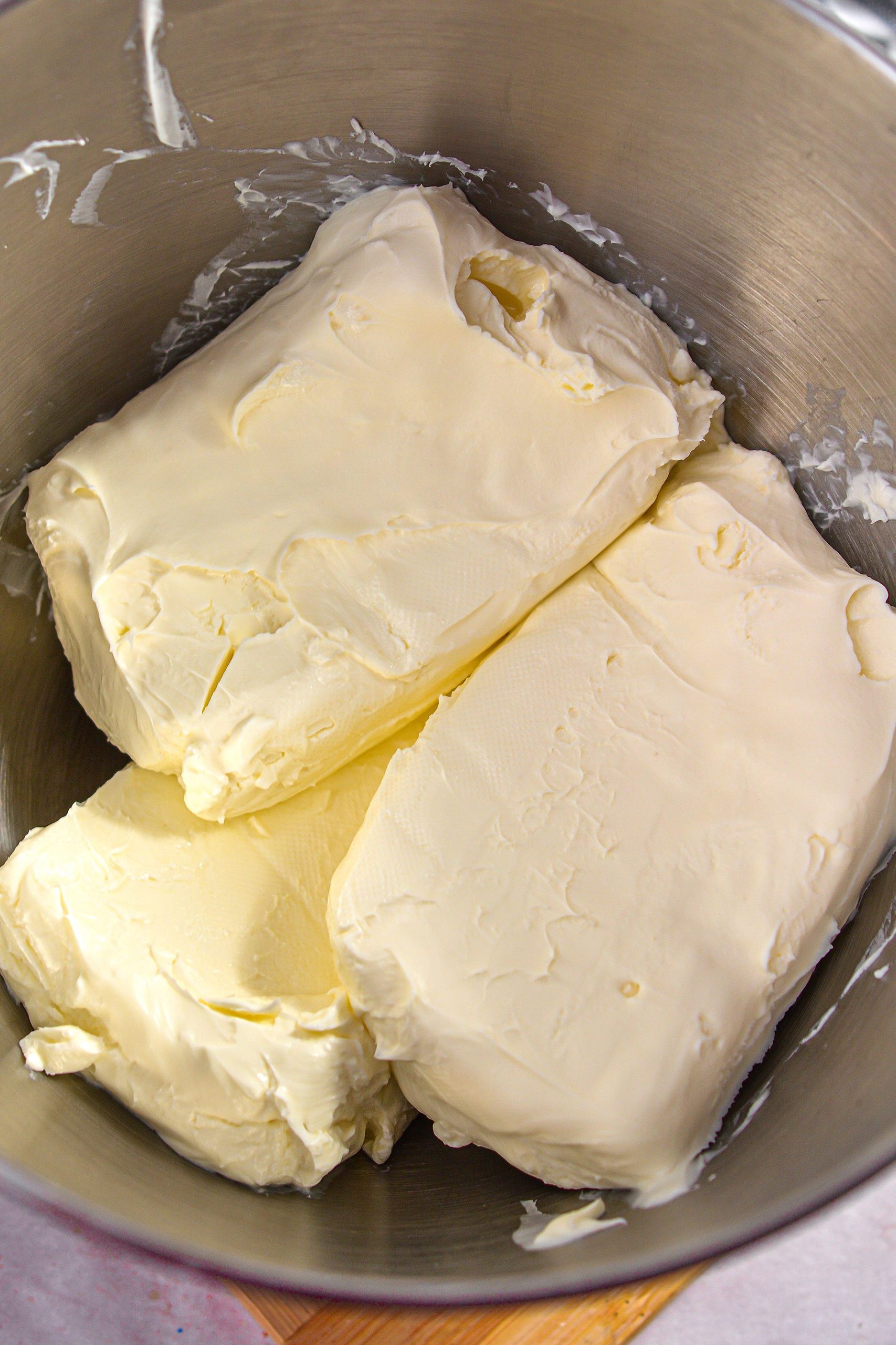 In a mixing bowl, beat together the cream cheese and the 1 cup sugar until smooth and fluffy.