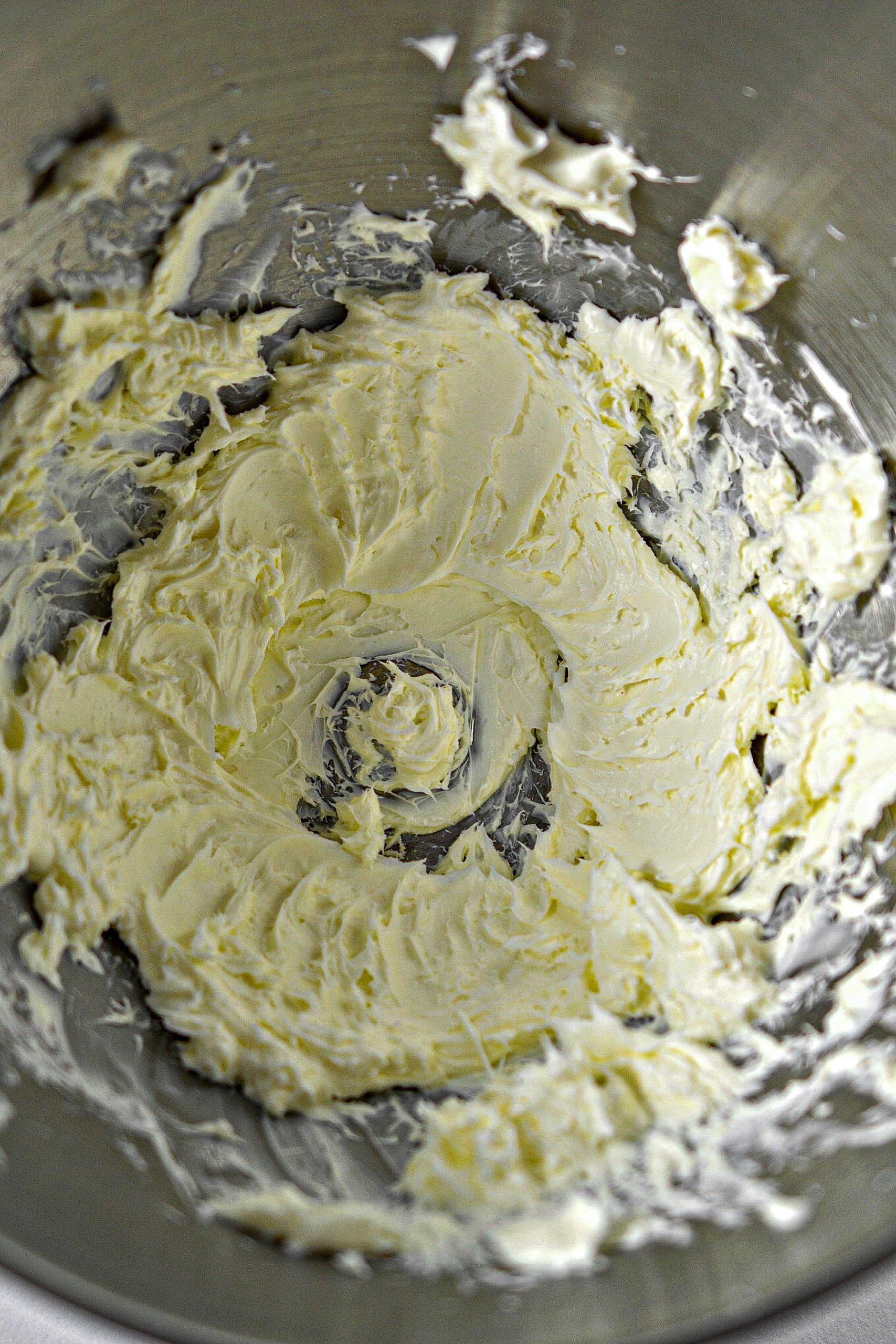  Blend the cream cheese until it is smooth and creamy.