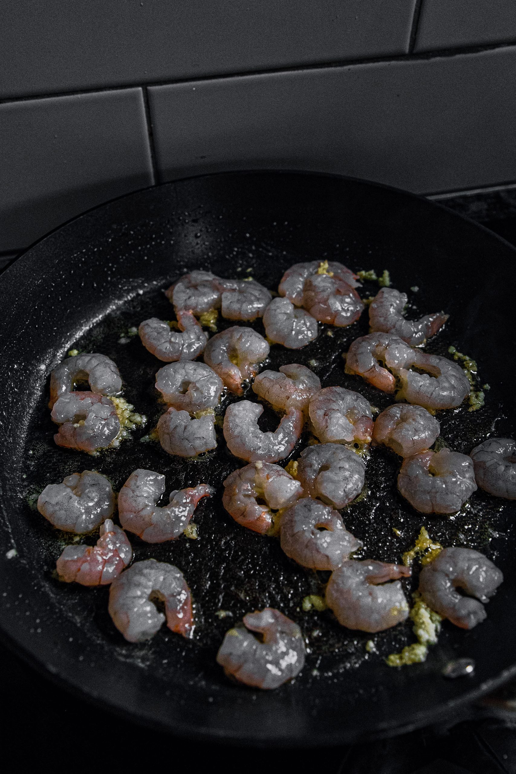 Add shrimp to the pan. Cook shrimp for a minute or so, stirring a few times.